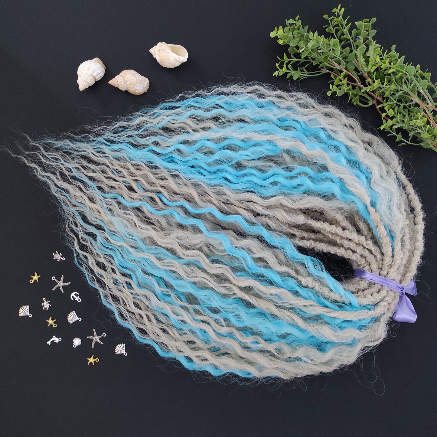 This is a soft, lightweight, and reusable synthetic set of double-ended regular curls (NOT BRUSHABLE) in a mix of platinum blonde and blue.
