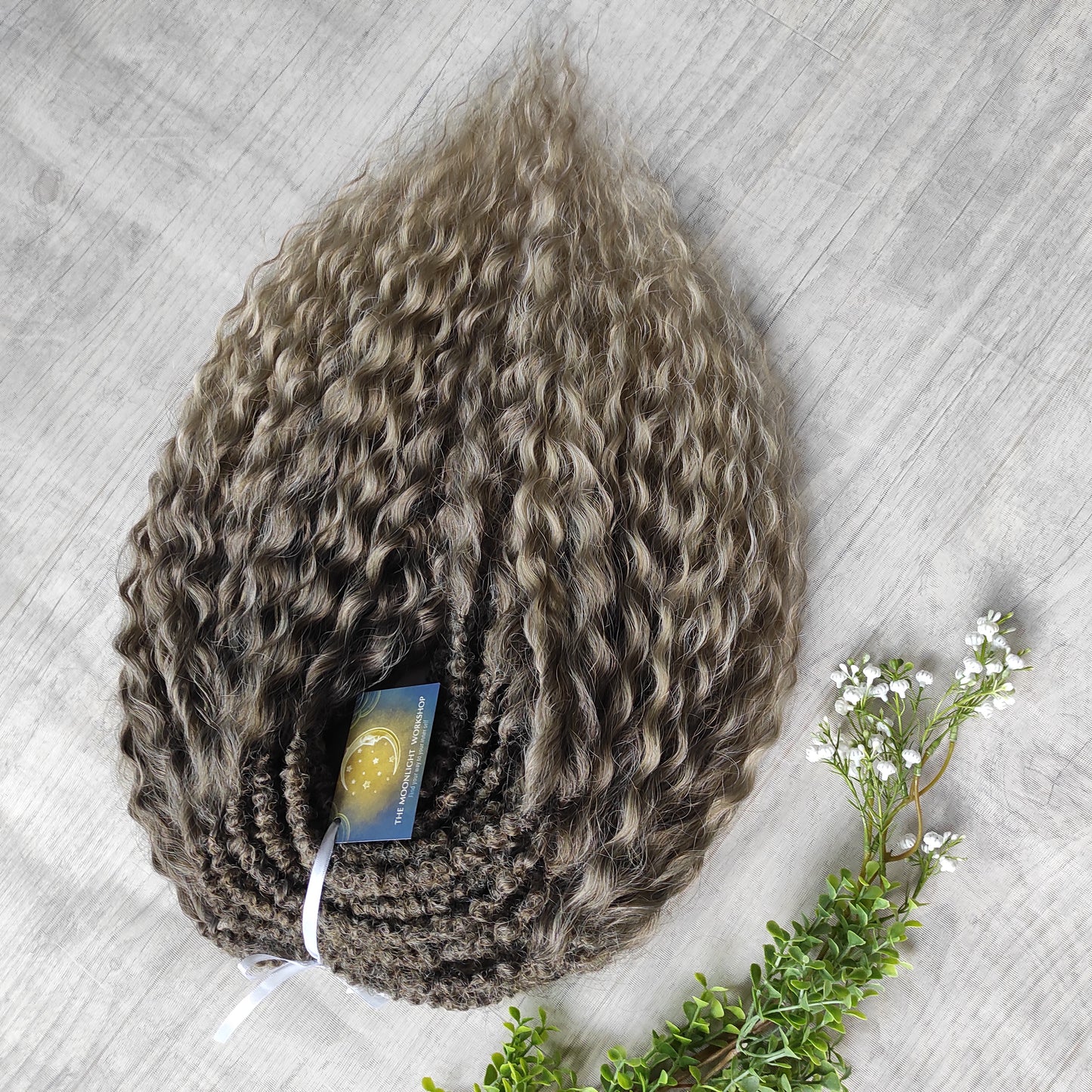 Ash ombre from light brown to wheat blonde (the color may look a bit different in different lighting). Soft, lightweight, and reusable synthetic brushable double ended wavy dreadlocks