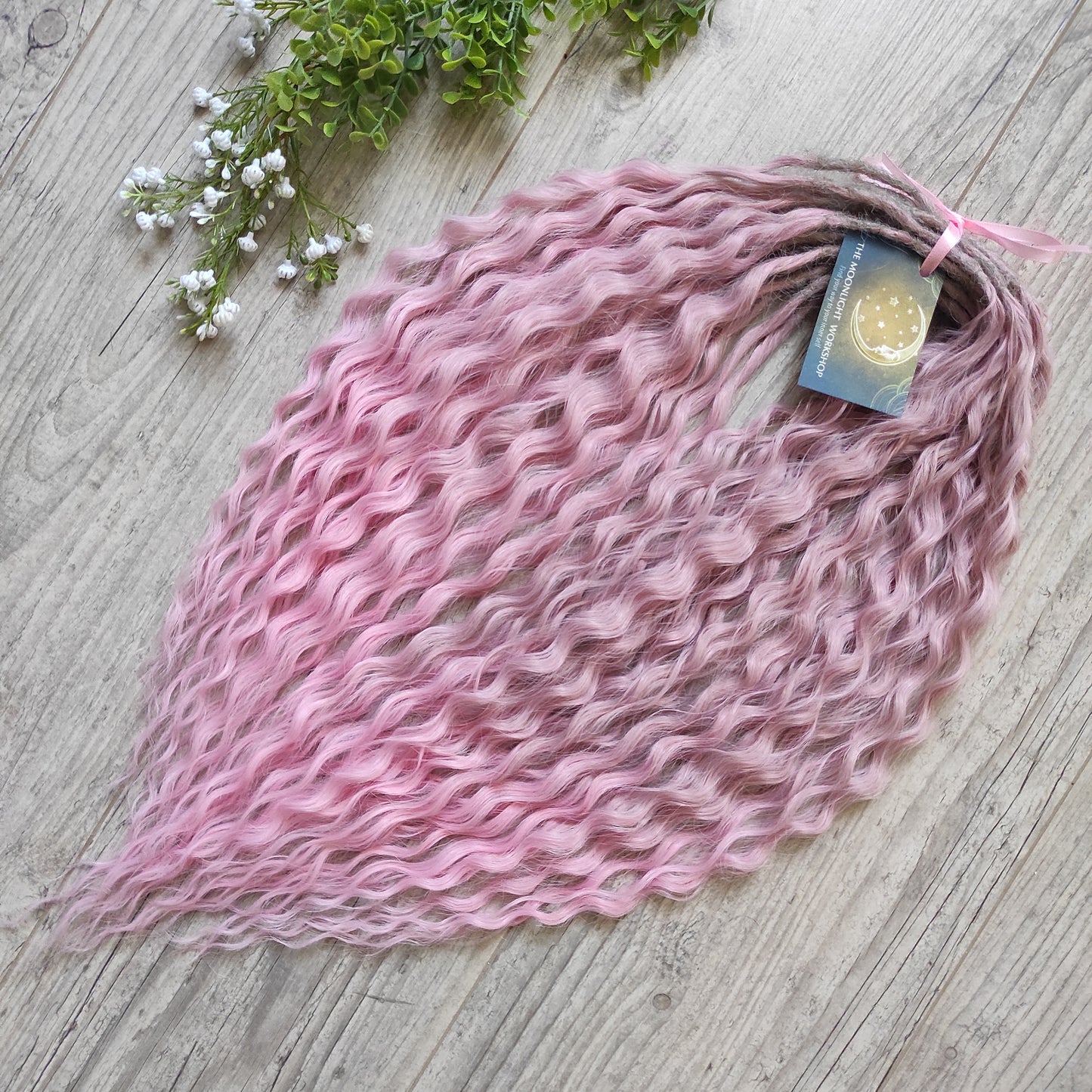 Dusty Rose features a soft pink ombré that fades beautifully from ash dusty rose roots to clean, pastel pink ends. The subtle gradient adds depth and a natural look, while maintaining a romantic, feminine tone.