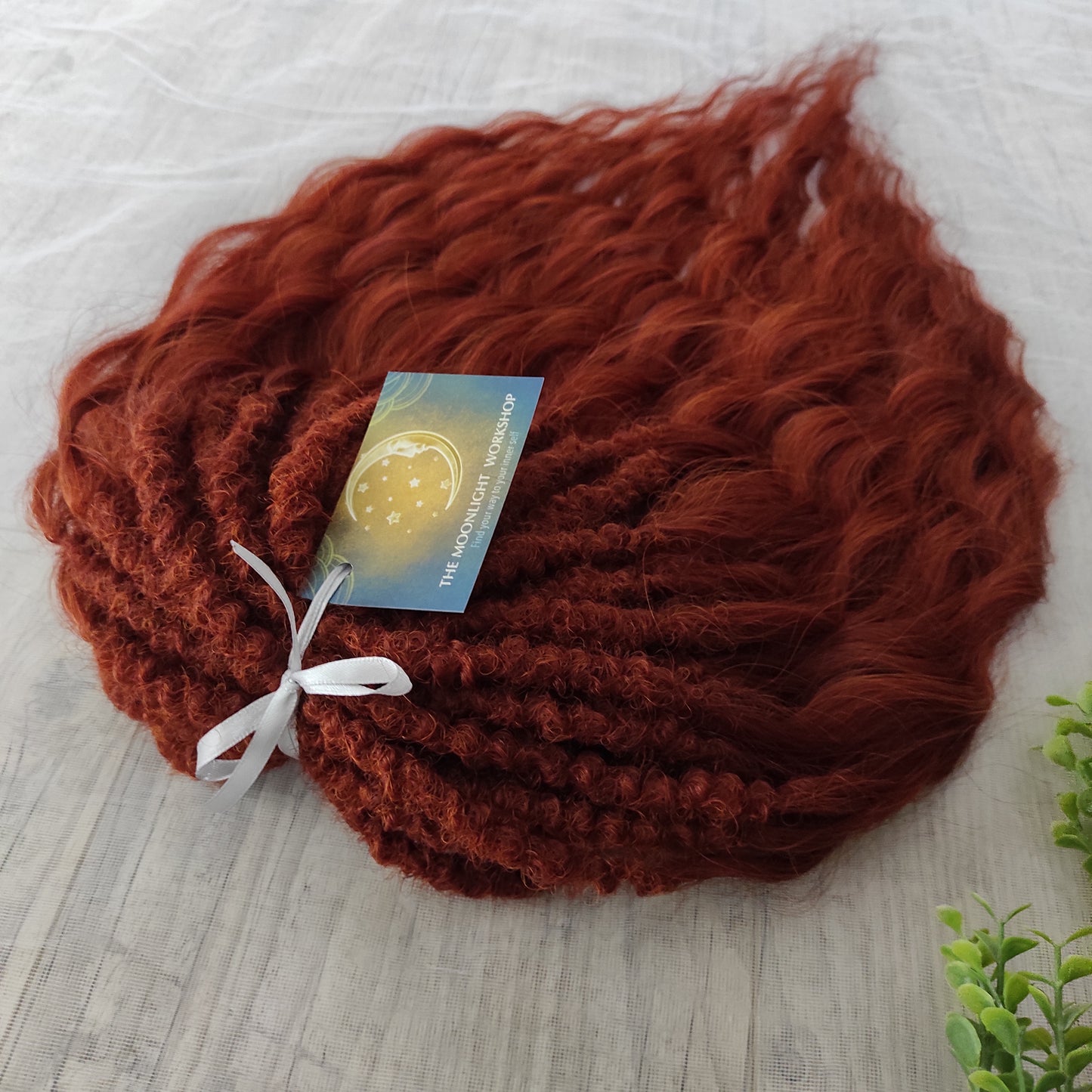 This rich, earthy shade of deep rusty red blends fiery energy with natural elegance — perfect for those who want a bold yet grounded look. Soft, lightweight, and reusable synthetic dreaded curls (standard dreaded, braided middle or push-up). Natural-looking waves let you brush these curls, which keeps them looking good longer!