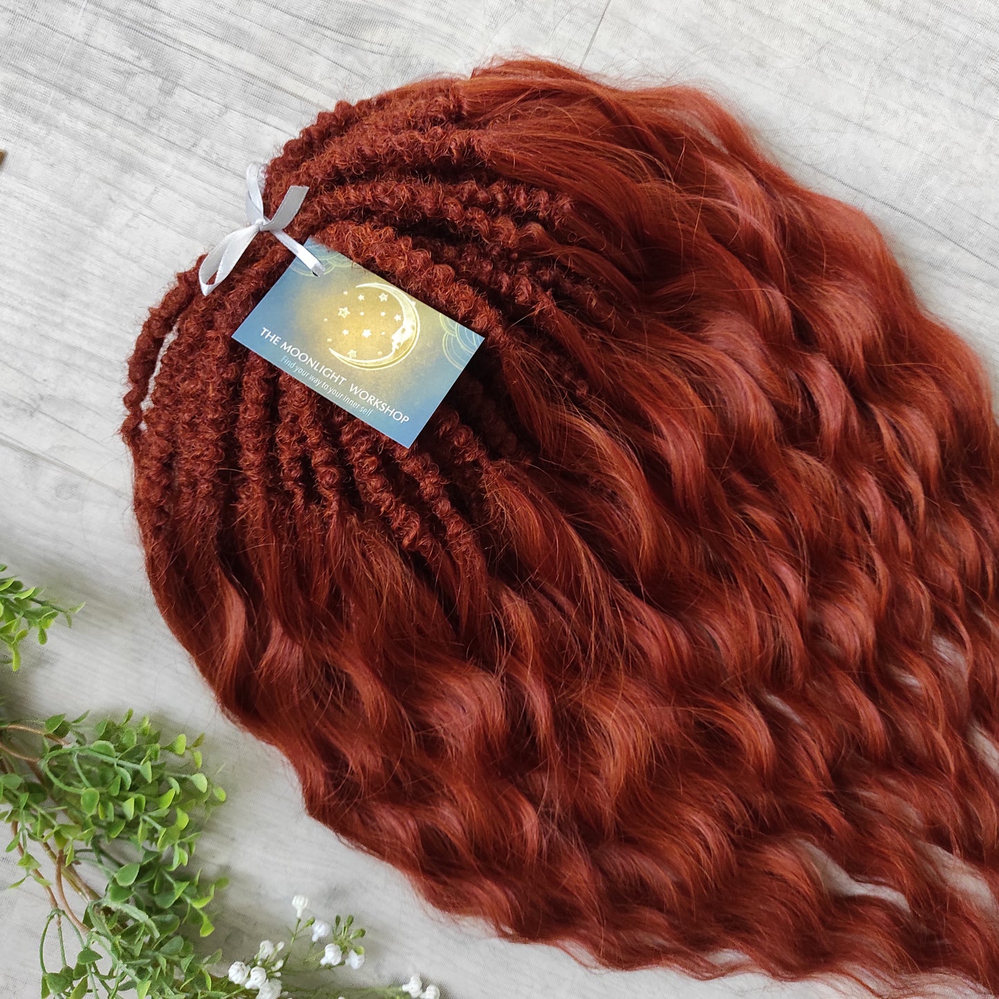 This rich, earthy shade of deep rusty red blends fiery energy with natural elegance — perfect for those who want a bold yet grounded look. Soft, lightweight, and reusable synthetic dreaded curls (standard dreaded, braided middle or push-up). Natural-looking waves let you brush these curls, which keeps them looking good longer!