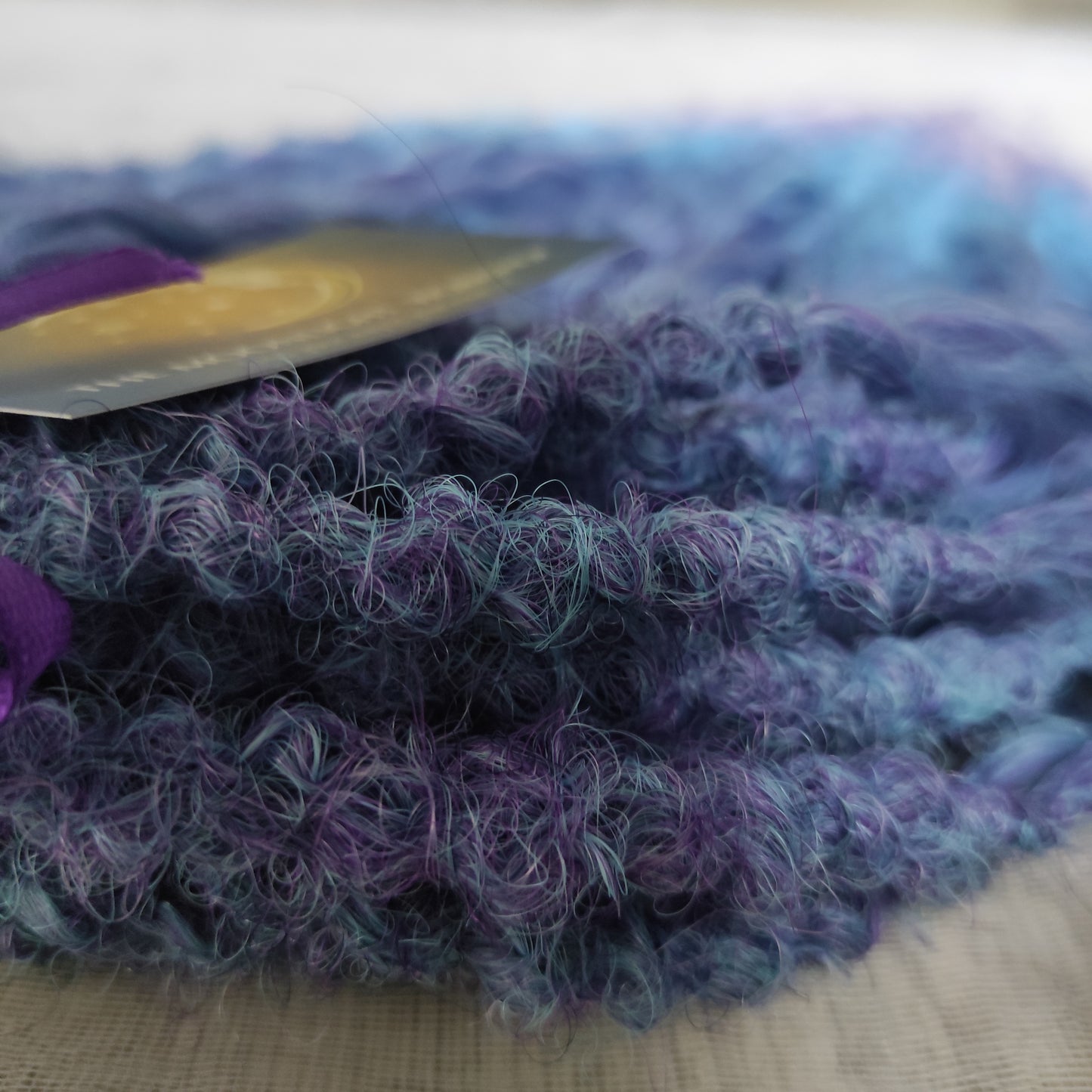 Soft, lightweight, and reusable synthetic sets of double ended regular curls (NOT BRUSHABLE) in blue and purple shades: ombre from indigo to sky blue and lavender.