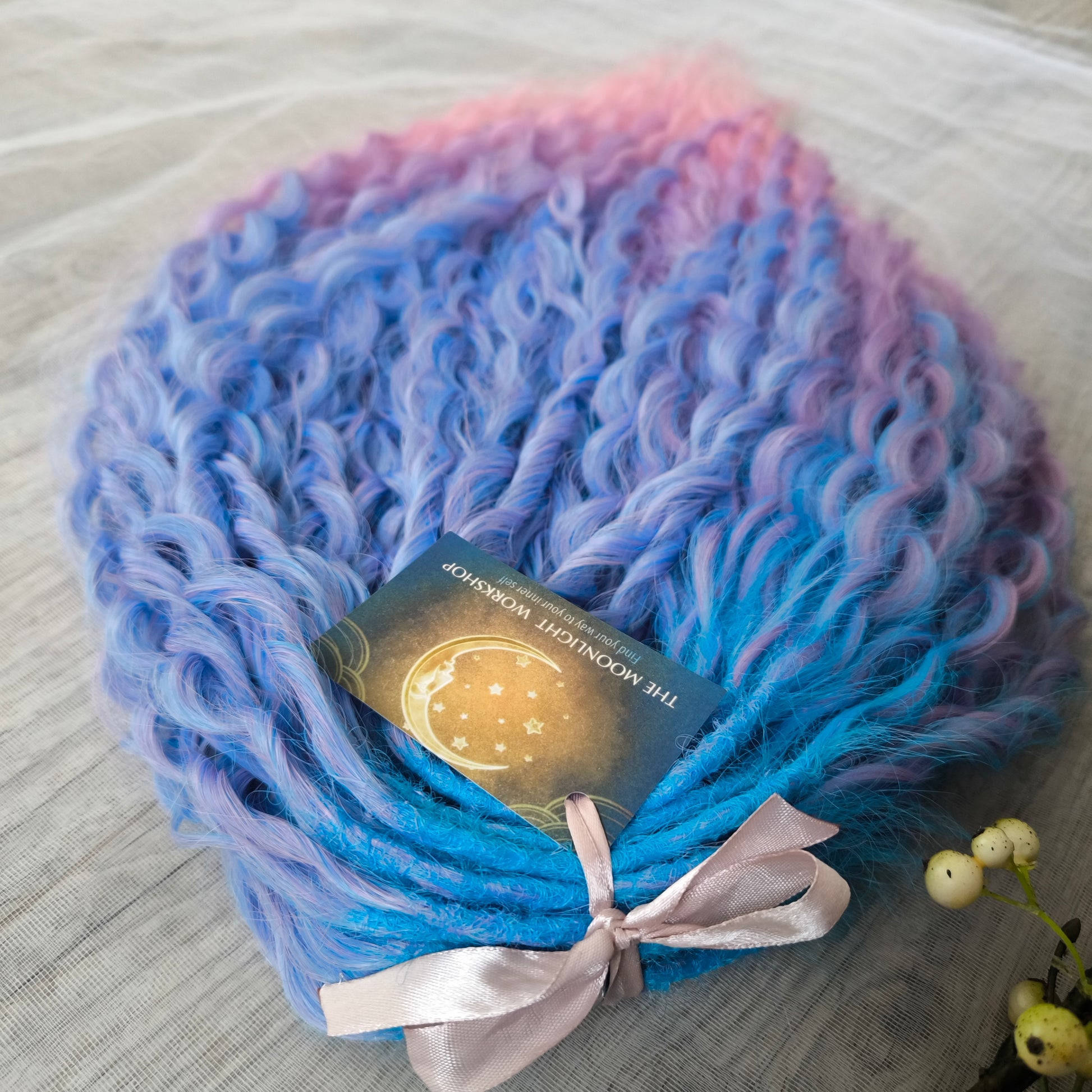 Soft, lightweight, and reusable synthetic sets of double ended regular curls (NOT BRUSHABLE) in blue and purple shades:  ombre from sky blue to lavender and pink;