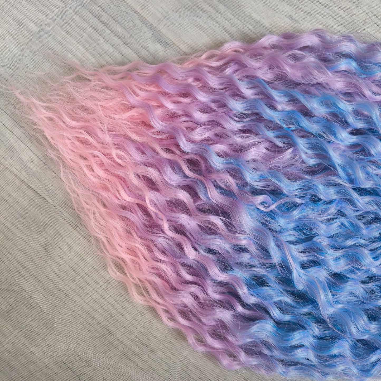 Soft, lightweight, and reusable synthetic sets of double ended regular curls (NOT BRUSHABLE) in blue and purple shades: ombre from sky blue to lavender and pink;