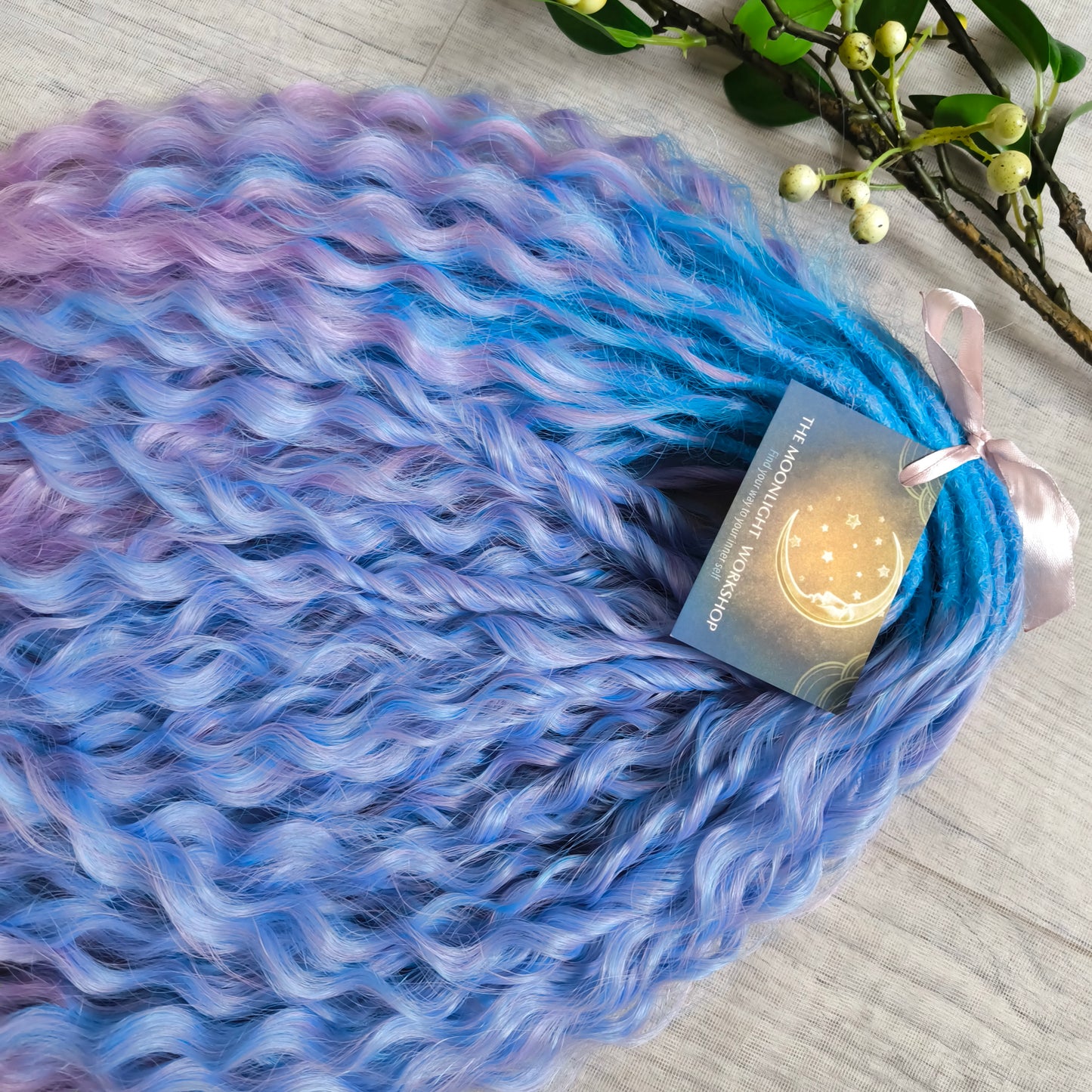Soft, lightweight, and reusable synthetic sets of double ended regular curls (NOT BRUSHABLE) in blue and purple shades: ombre from sky blue to lavender and pink;