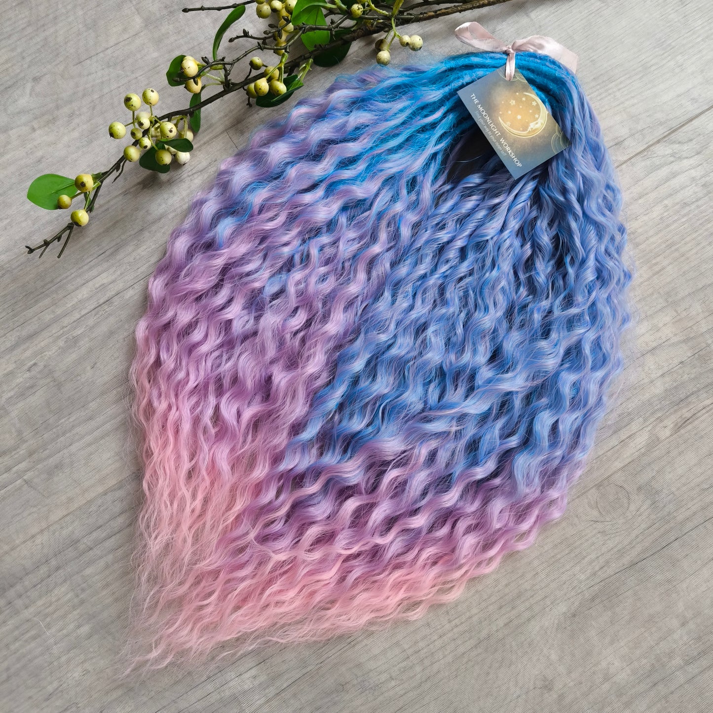 Soft, lightweight, and reusable synthetic sets of double ended regular curls (NOT BRUSHABLE) in blue and purple shades: ombre from sky blue to lavender and pink;