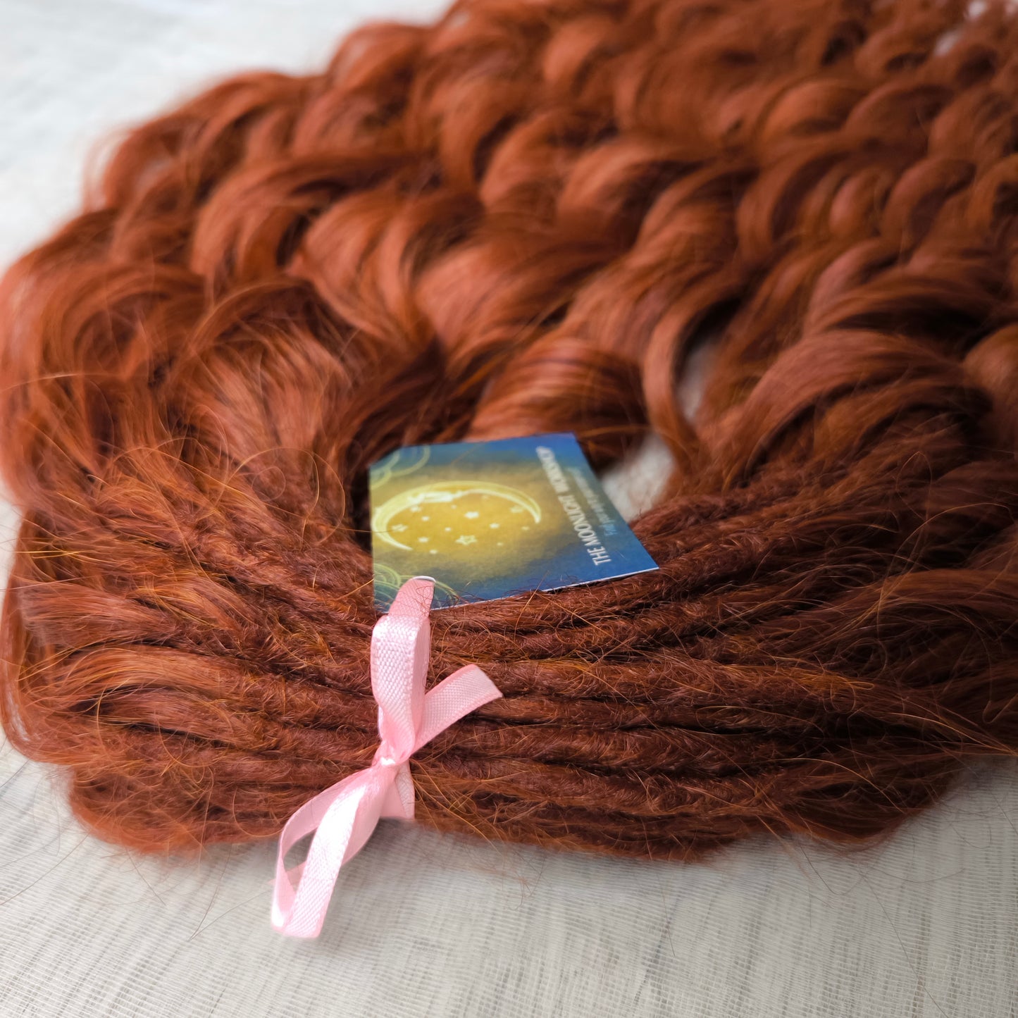 This rich, earthy shade of deep rusty red blends fiery energy with natural elegance — perfect for those who want a bold yet grounded look. Soft, lightweight, and reusable synthetic dreaded curls (standard dreaded, braided middle or push-up). Natural-looking waves let you brush these curls, which keeps them looking good longer!