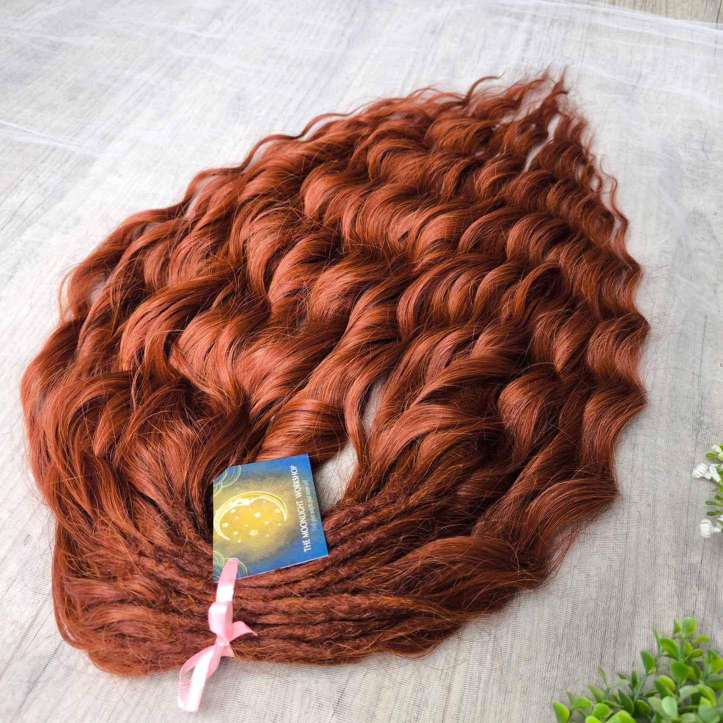 This rich, earthy shade of deep rusty red blends fiery energy with natural elegance — perfect for those who want a bold yet grounded look. Soft, lightweight, and reusable synthetic dreaded curls (standard dreaded, braided middle or push-up). Natural-looking waves let you brush these curls, which keeps them looking good longer!