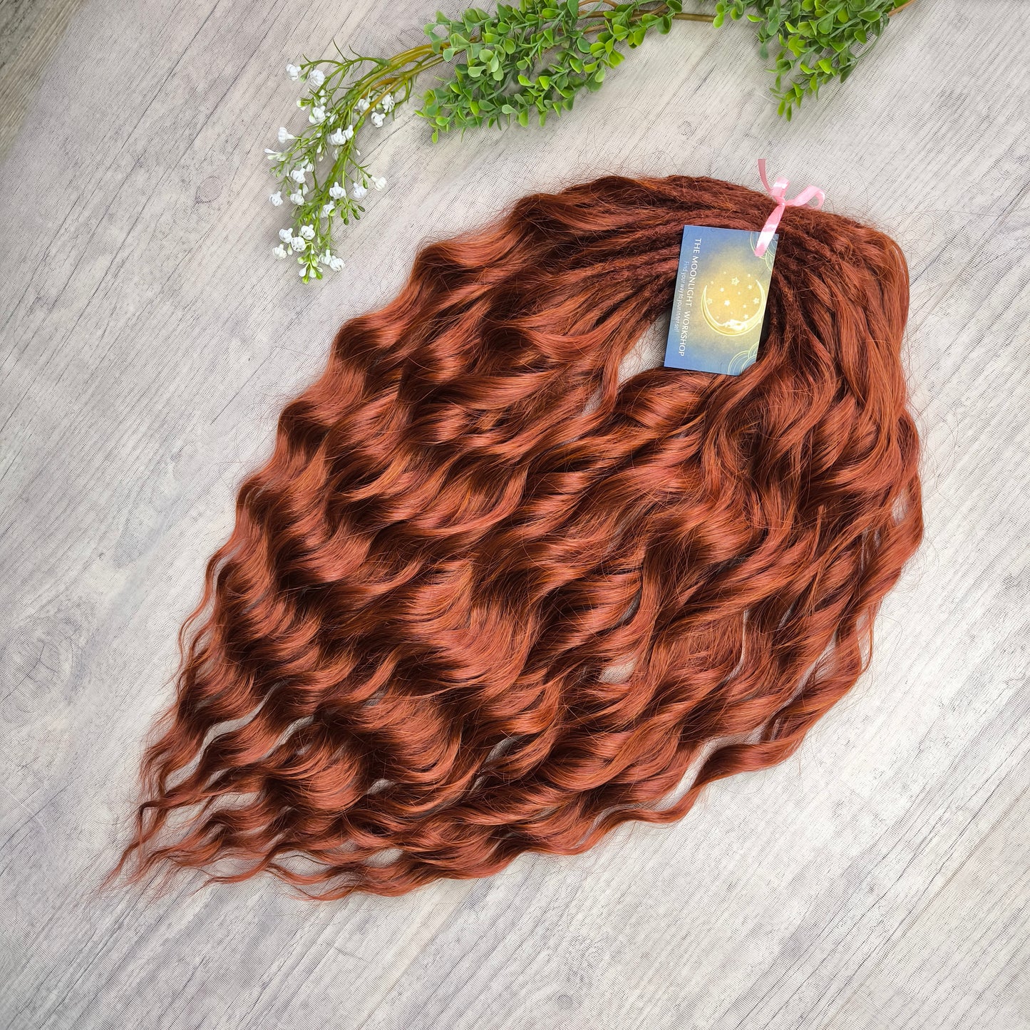 This rich, earthy shade of deep rusty red blends fiery energy with natural elegance — perfect for those who want a bold yet grounded look. Soft, lightweight, and reusable synthetic dreaded curls (standard dreaded, braided middle or push-up). Natural-looking waves let you brush these curls, which keeps them looking good longer!