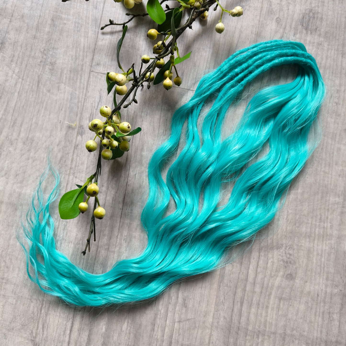 Turquoise green soft, lightweight, and reusable synthetic brushable double-ended wavy dreadlocks (regular dreaded, braided middle or push-up).