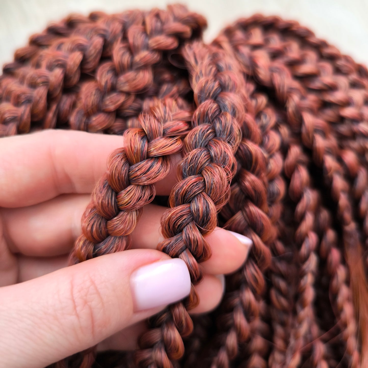 This rich, earthy shade of deep rusty red blends fiery energy with natural elegance — perfect for those who want a bold yet grounded look. Soft, lightweight, and reusable synthetic dreaded curls (standard dreaded, braided middle or push-up). Natural-looking waves let you brush these curls, which keeps them looking good longer!