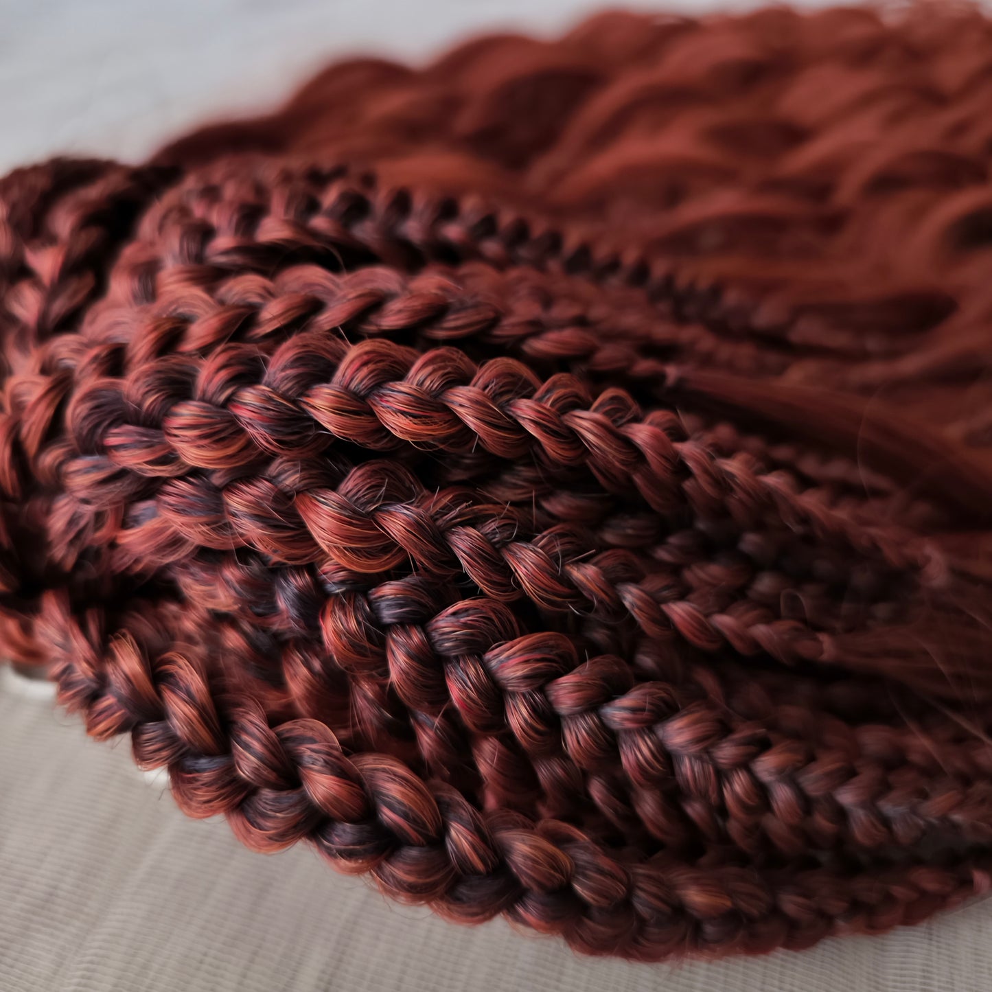 This rich, earthy shade of deep rusty red blends fiery energy with natural elegance — perfect for those who want a bold yet grounded look. Soft, lightweight, and reusable synthetic dreaded curls (standard dreaded, braided middle or push-up). Natural-looking waves let you brush these curls, which keeps them looking good longer!