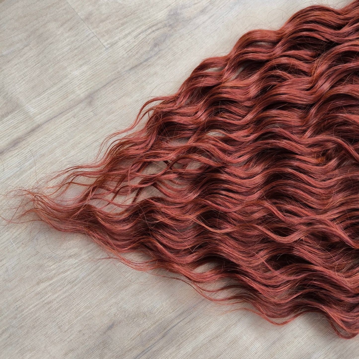 This rich, earthy shade of deep rusty red blends fiery energy with natural elegance — perfect for those who want a bold yet grounded look. Soft, lightweight, and reusable synthetic dreaded curls (standard dreaded, braided middle or push-up). Natural-looking waves let you brush these curls, which keeps them looking good longer!