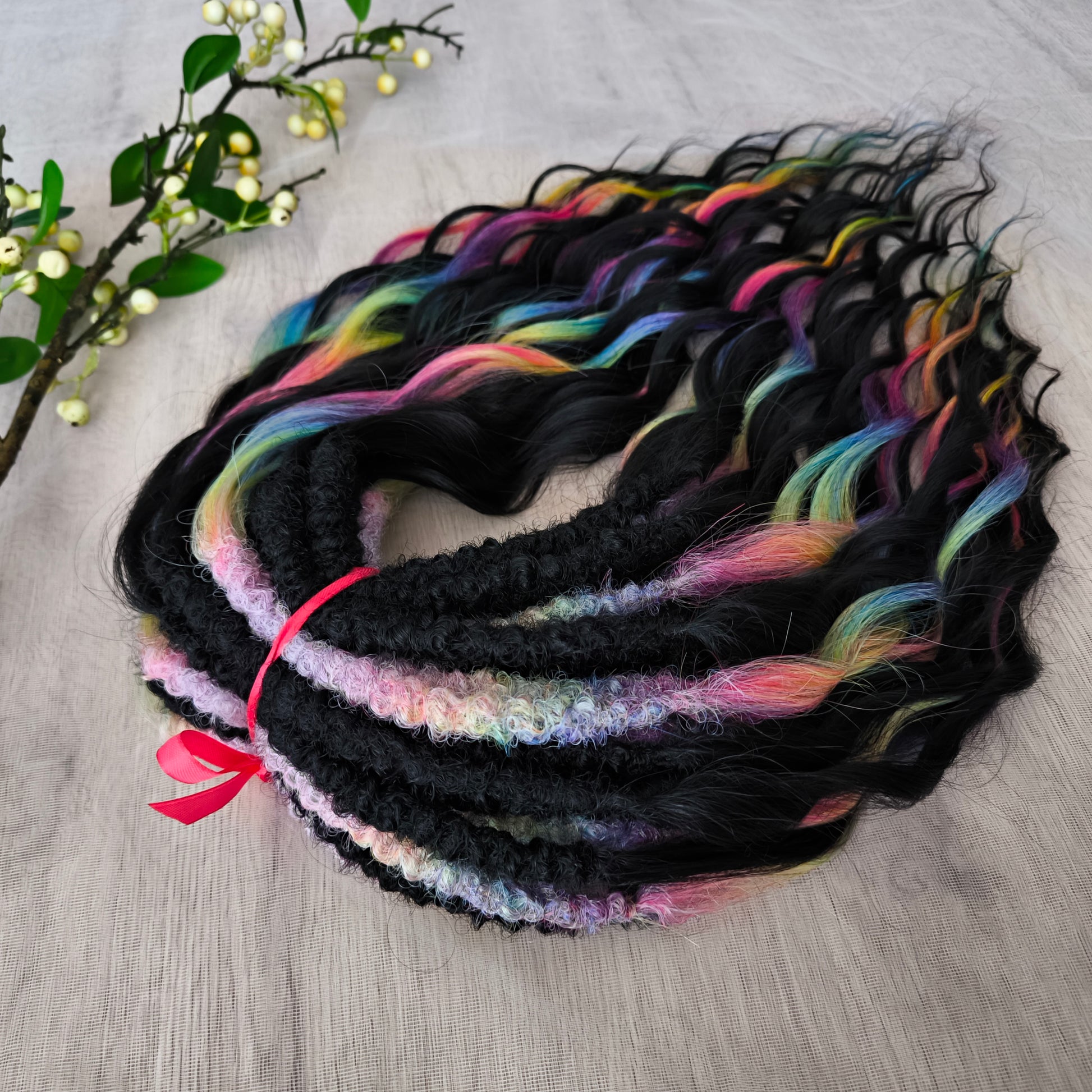The mix of Black and Rainbow/glitch/prism effect (2/3 parts of black + 1/3 part of rainbow) soft, lightweight, and reusable synthetic brushable double ended wavy dreadlocks.