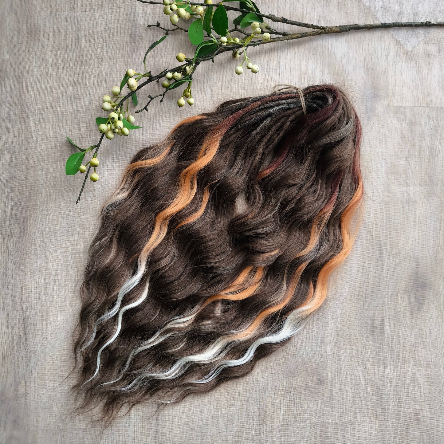 This moody, elegant set of soft, lightweight, and reusable synthetic brushable double-ended wavy dreadlocks features 2 shades of brown as the main color, enriched with calico strands.