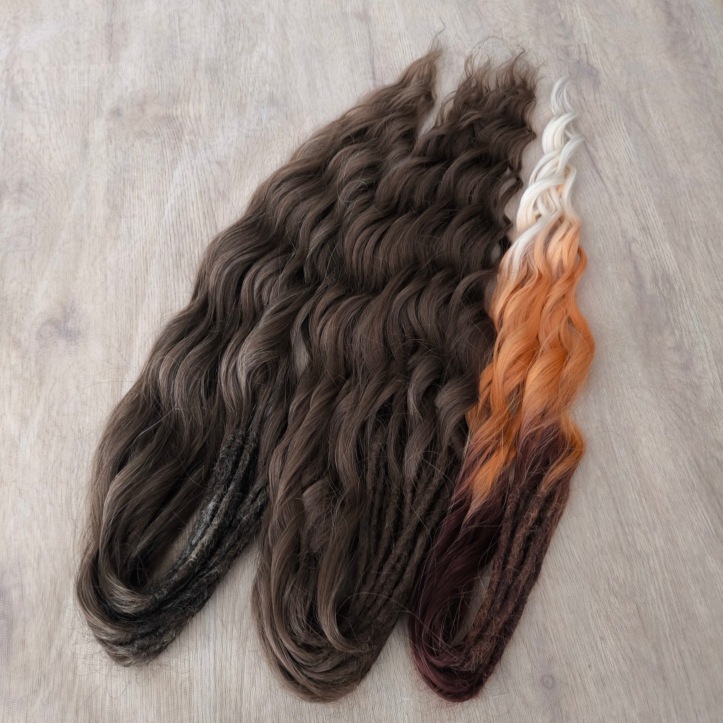 This moody, elegant set of soft, lightweight, and reusable synthetic brushable double-ended wavy dreadlocks features 2 shades of brown as the main color, enriched with calico strands.