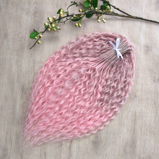 Dusty Rose features a soft pink ombré that fades beautifully from ash dusty rose roots to clean, pastel pink ends. The subtle gradient adds depth and a natural look, while maintaining a romantic, feminine tone.