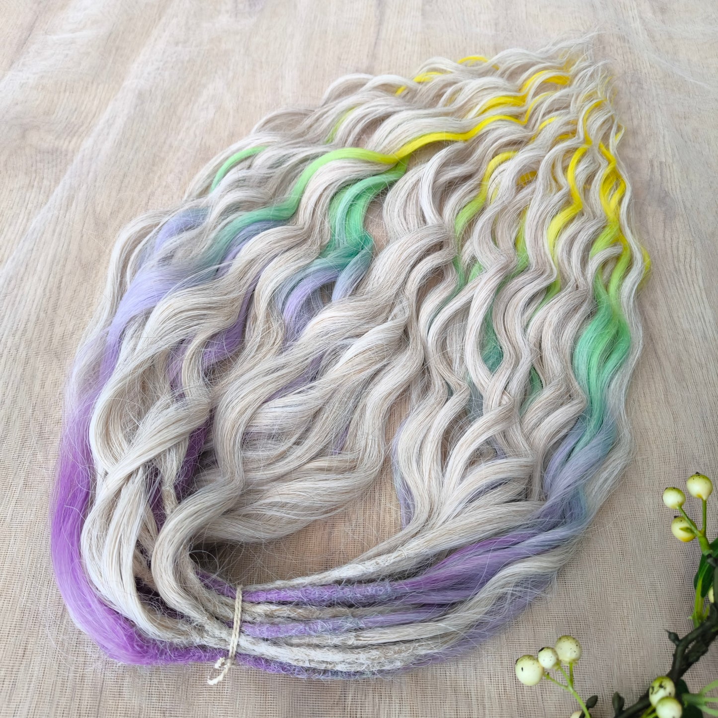 The mix of Platinum Blonde and Multicolored ombre from purple/lavender to light green and yellow soft, lightweight, and reusable synthetic brushable double ended wavy dreadlocks (regular dreaded or push-up): 2/3 parts of blonde + 1/3 part of rainbow