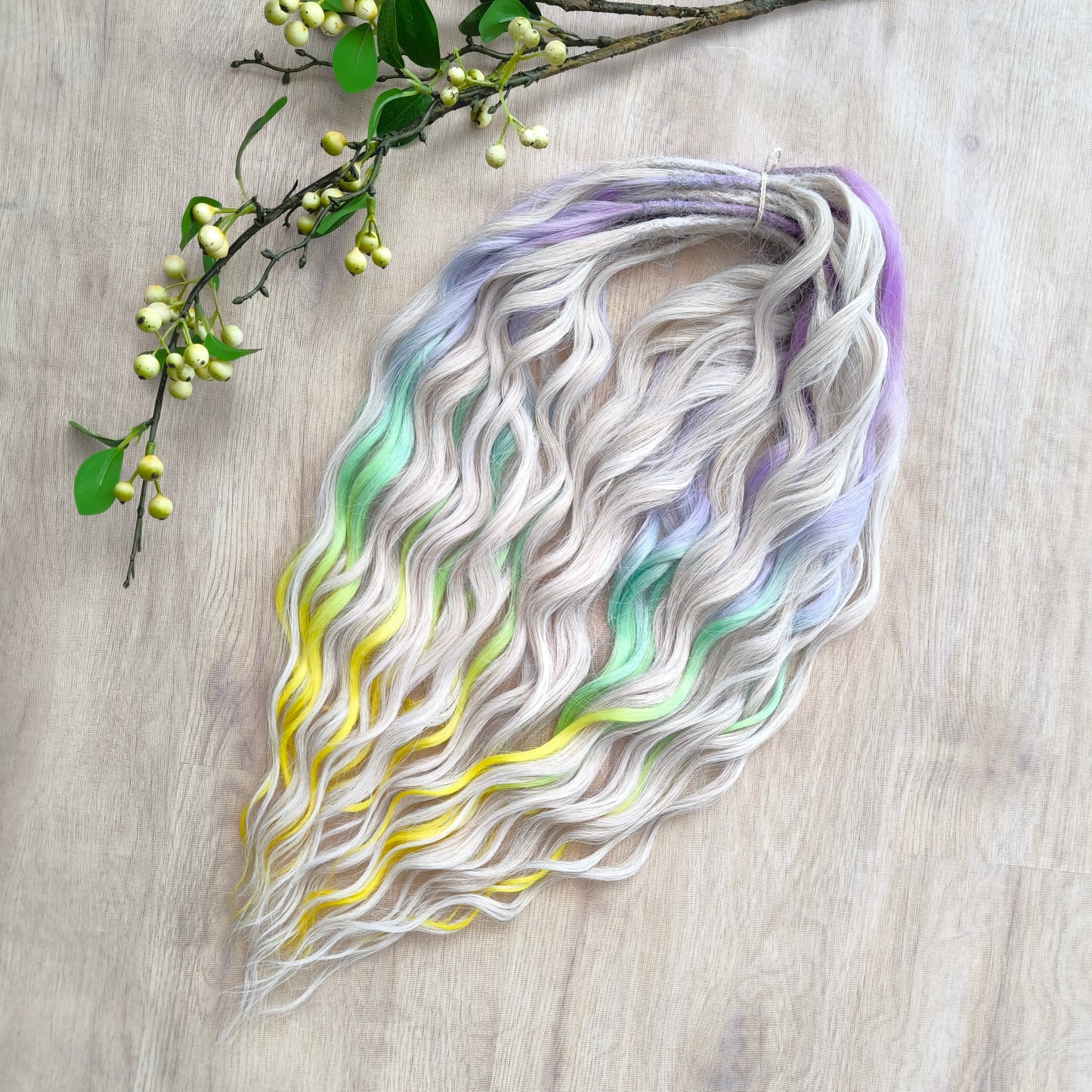 The mix of Platinum Blonde and Multicolored ombre from purple/lavender to light green and yellow soft, lightweight, and reusable synthetic brushable double ended wavy dreadlocks (regular dreaded or push-up): 2/3 parts of blonde + 1/3 part of rainbow