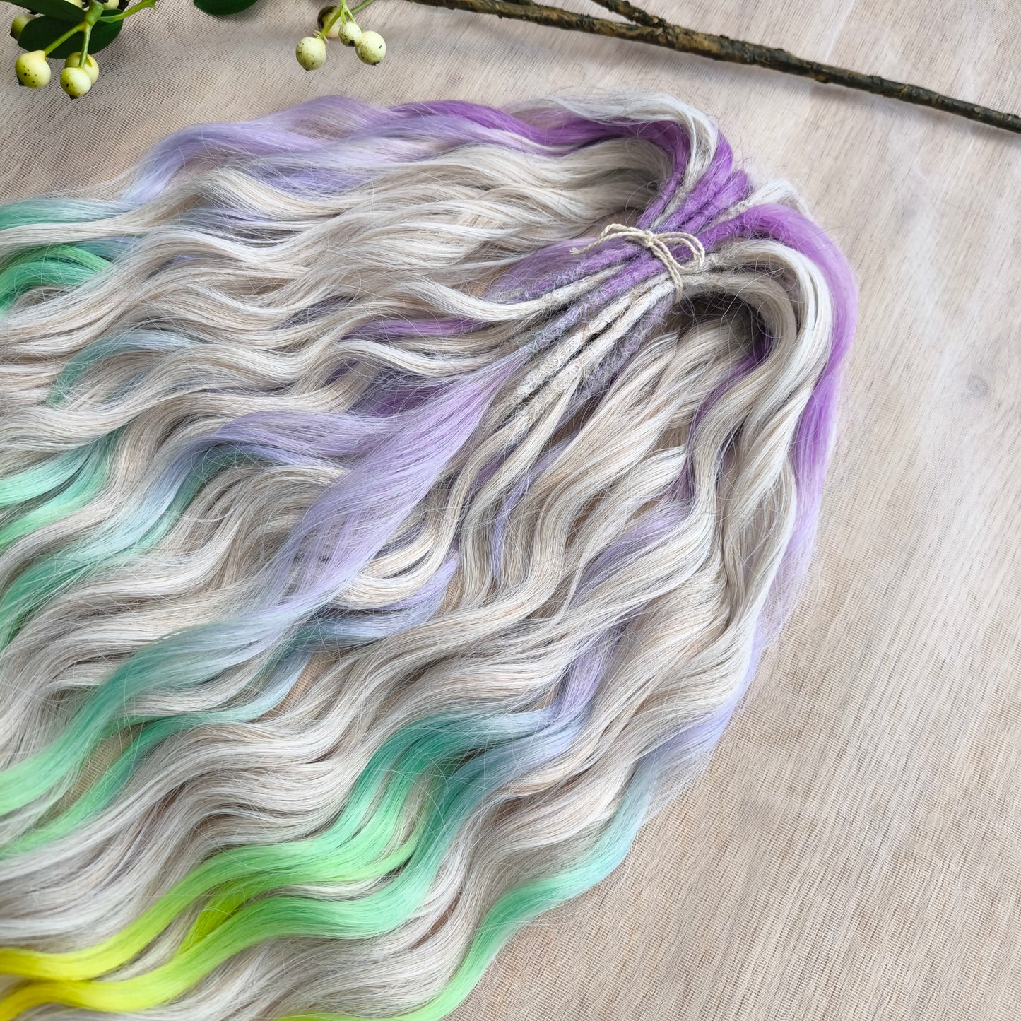 The mix of Platinum Blonde and Multicolored ombre from purple/lavender to light green and yellow soft, lightweight, and reusable synthetic brushable double ended wavy dreadlocks (regular dreaded or push-up): 2/3 parts of blonde + 1/3 part of rainbow