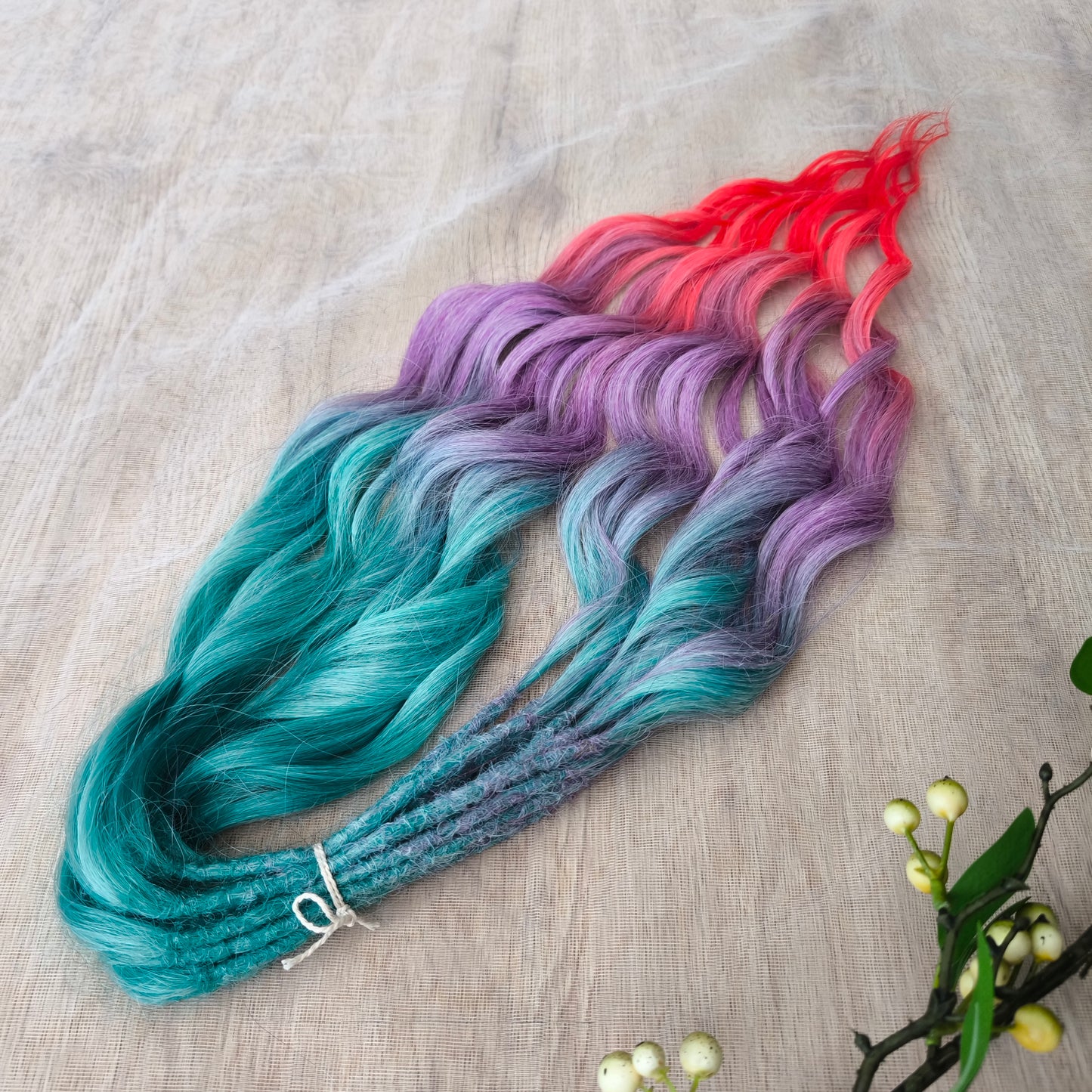 Colorful Rainbow prism (ombre from green to purple and red), soft, lightweight, and reusable synthetic sets of wavy double ended brushable dreadlocks.