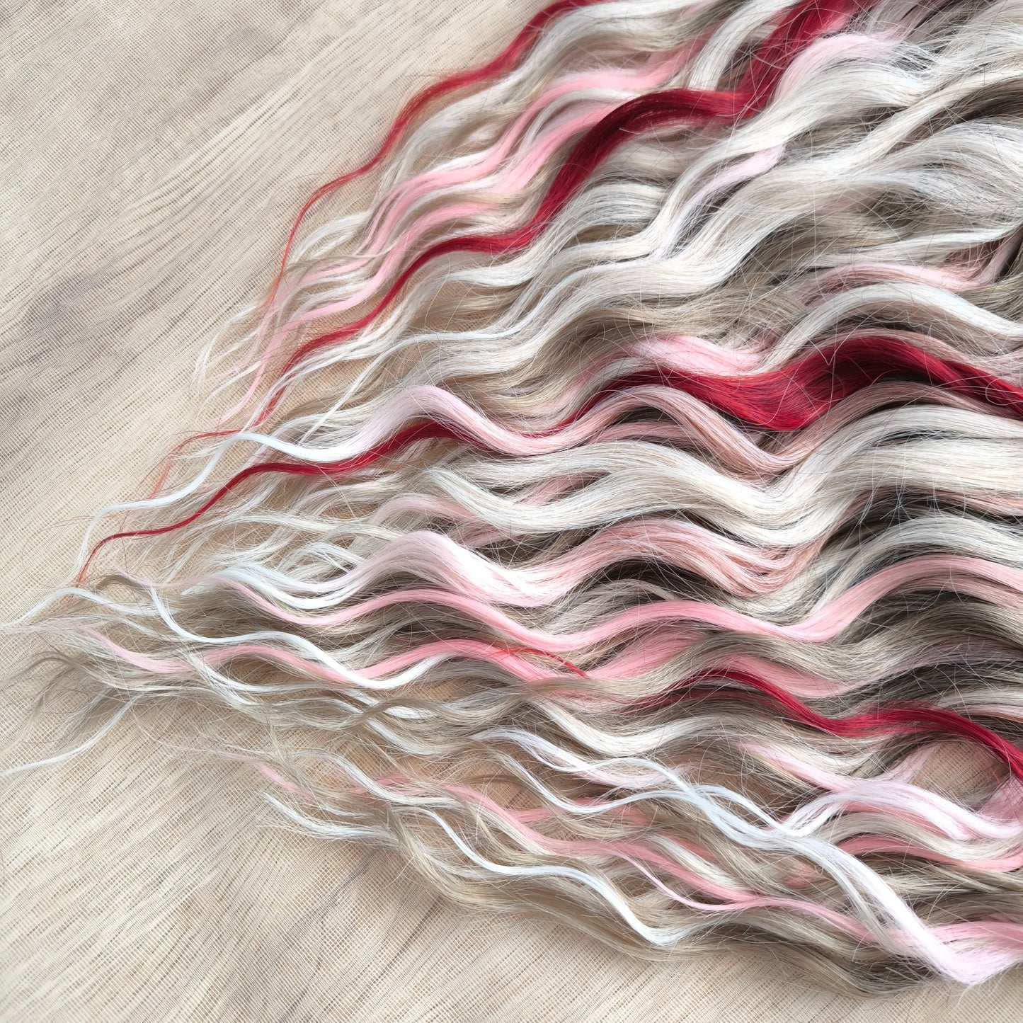 Soft, lightweight, and reusable synthetic brushable double ended wavy dreadlocks (regular dreaded or push-up). Mix of a few colors: platinum and ombre wheat blondes, various pink, and burgundy.