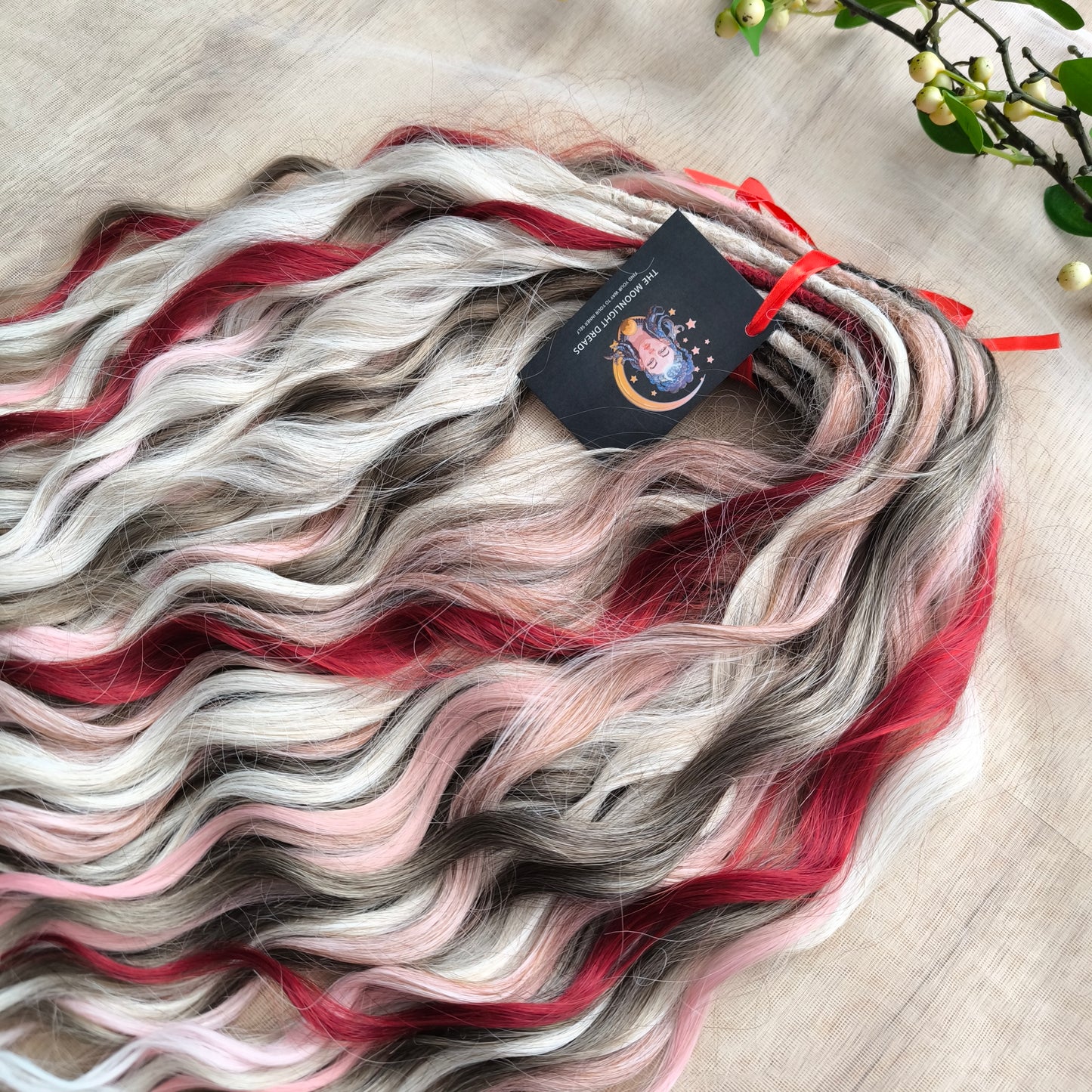 Soft, lightweight, and reusable synthetic brushable double ended wavy dreadlocks (regular dreaded or push-up). Mix of a few colors: platinum and ombre wheat blondes, various pink, and burgundy.