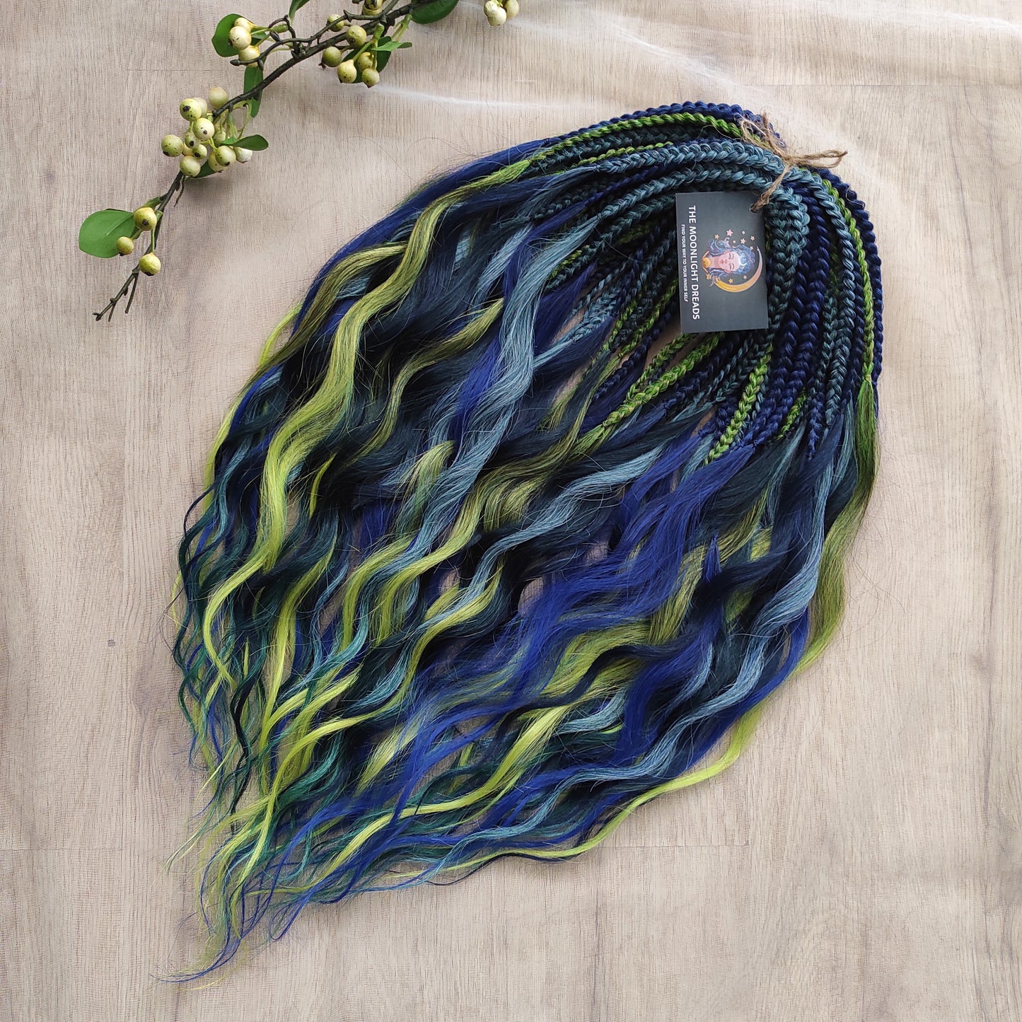 Inspired by the feathers of a peacock and the magic of the deep forest, this set blends rich navy, electric blue, moss green, lime, and seafoam in an eye-catching gradient. Whether you're stepping into a festival or simply expressing your wild side, this look makes a powerful statement.
Soft, lightweight, and reusable synthetic brushable double ended wavy dreadlocks, a mix of Anna and Body wave with braided middle.