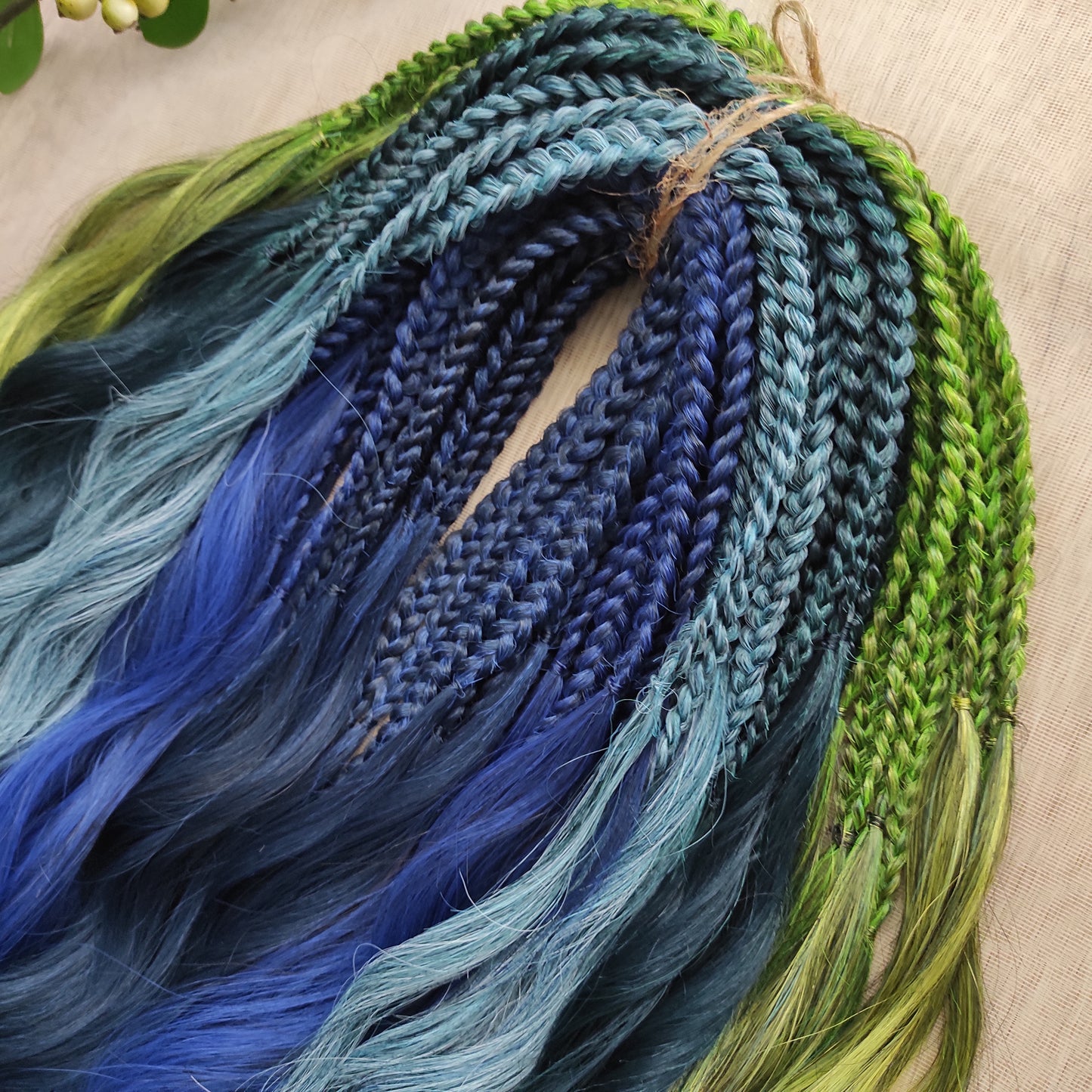 Inspired by the feathers of a peacock and the magic of the deep forest, this set blends rich navy, electric blue, moss green, lime, and seafoam in an eye-catching gradient. Whether you're stepping into a festival or simply expressing your wild side, this look makes a powerful statement.
Soft, lightweight, and reusable synthetic brushable double ended wavy dreadlocks, a mix of Anna and Body wave with braided middle.
