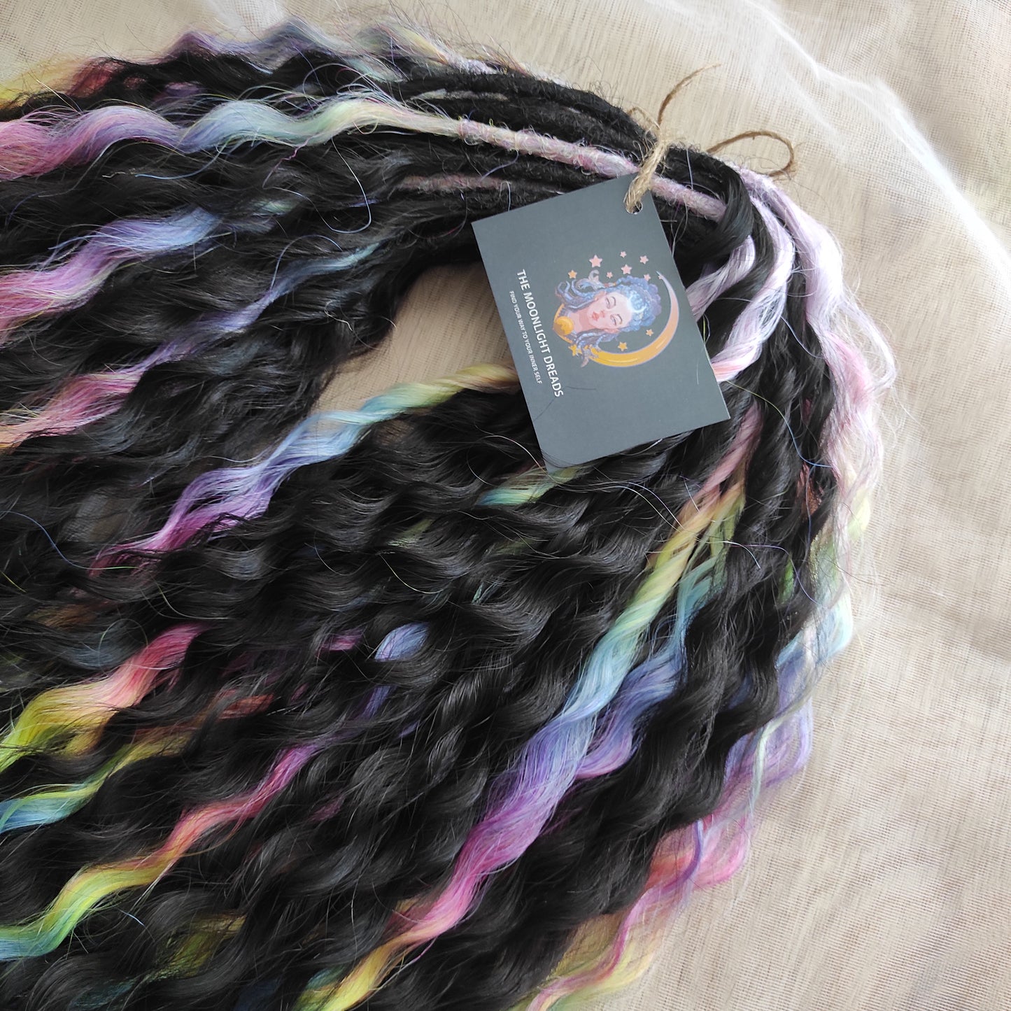 The mix of Black and Rainbow/glitch/prism effect soft, lightweight, and reusable synthetic brushable double ended wavy dreadlocks (NOT BRUSHABLE).