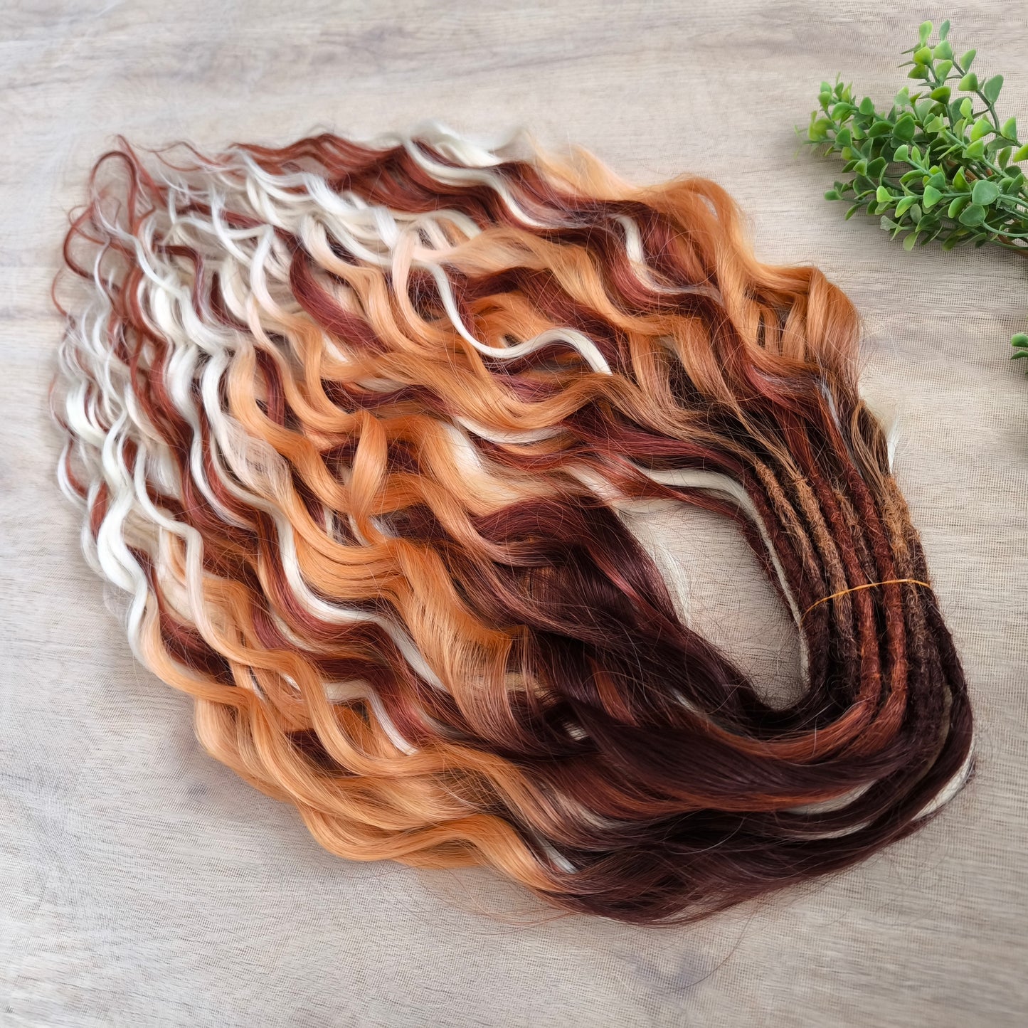 This set combines a rich three-tone ombré gradient — deep chestnut, warm copper, and pale blonde — with additional solid strands in copper and creamy platinum, creating a stunning play of light and color.
Inspired by autumn leaves, glowing embers, and the graceful energy of a wild fox, Amber Fox is made to stand out with both softness and strength.
Soft, lightweight, and reusable synthetic brushable double ended wavy dreadlocks (available as regular dreaded, braided middle, or push-up).