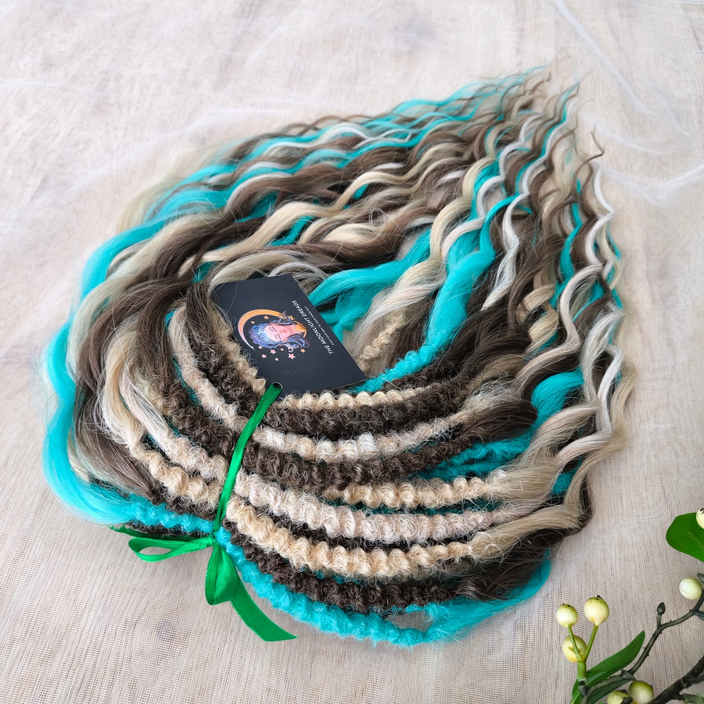 Brown, 2 shades of blonde, and turquoise green soft, lightweight, and reusable synthetic brushable double-ended wavy dreadlocks (regular dreaded or push-up)