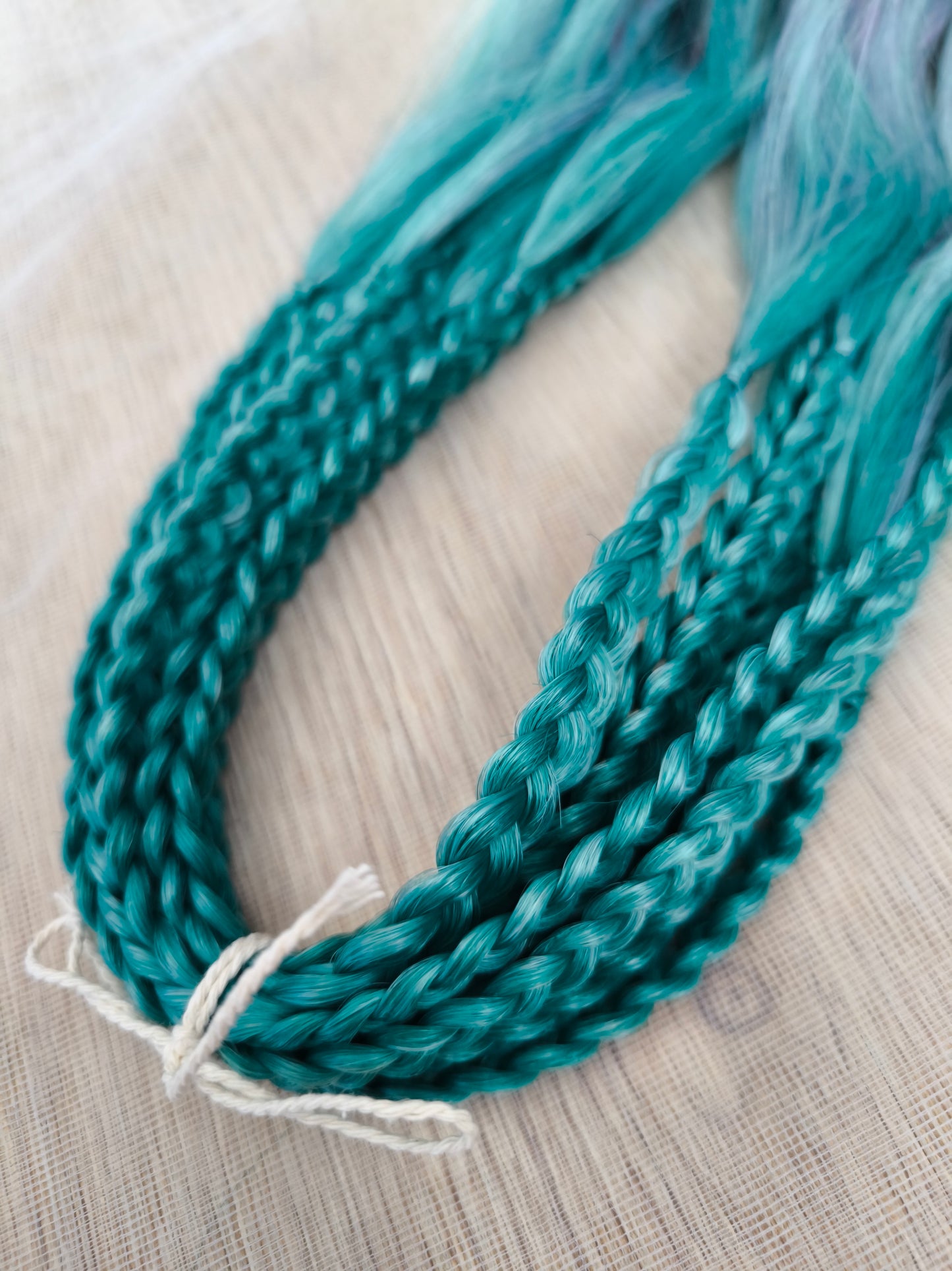 Colorful Rainbow prism (ombre from green to purple and red), soft, lightweight, and reusable synthetic sets of wavy double ended brushable dreadlocks.