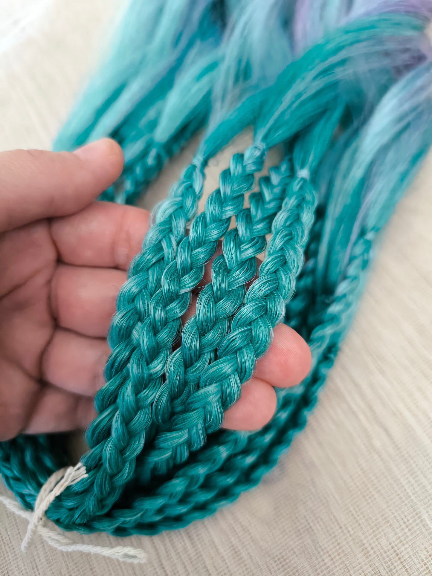 Colorful Rainbow prism (ombre from green to purple and red), soft, lightweight, and reusable synthetic sets of wavy double ended brushable dreadlocks.