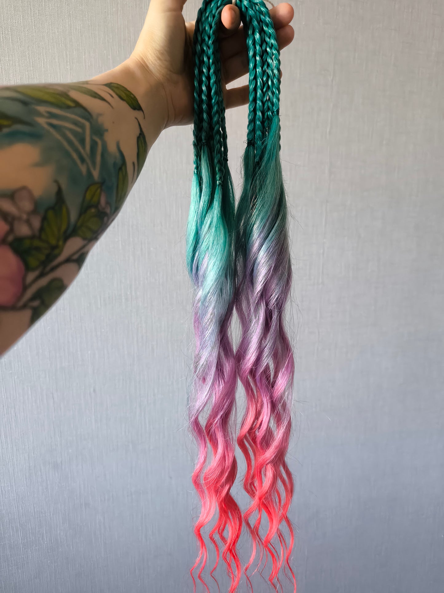 Colorful Rainbow prism (ombre from green to purple and red), soft, lightweight, and reusable synthetic sets of wavy double ended brushable dreadlocks.