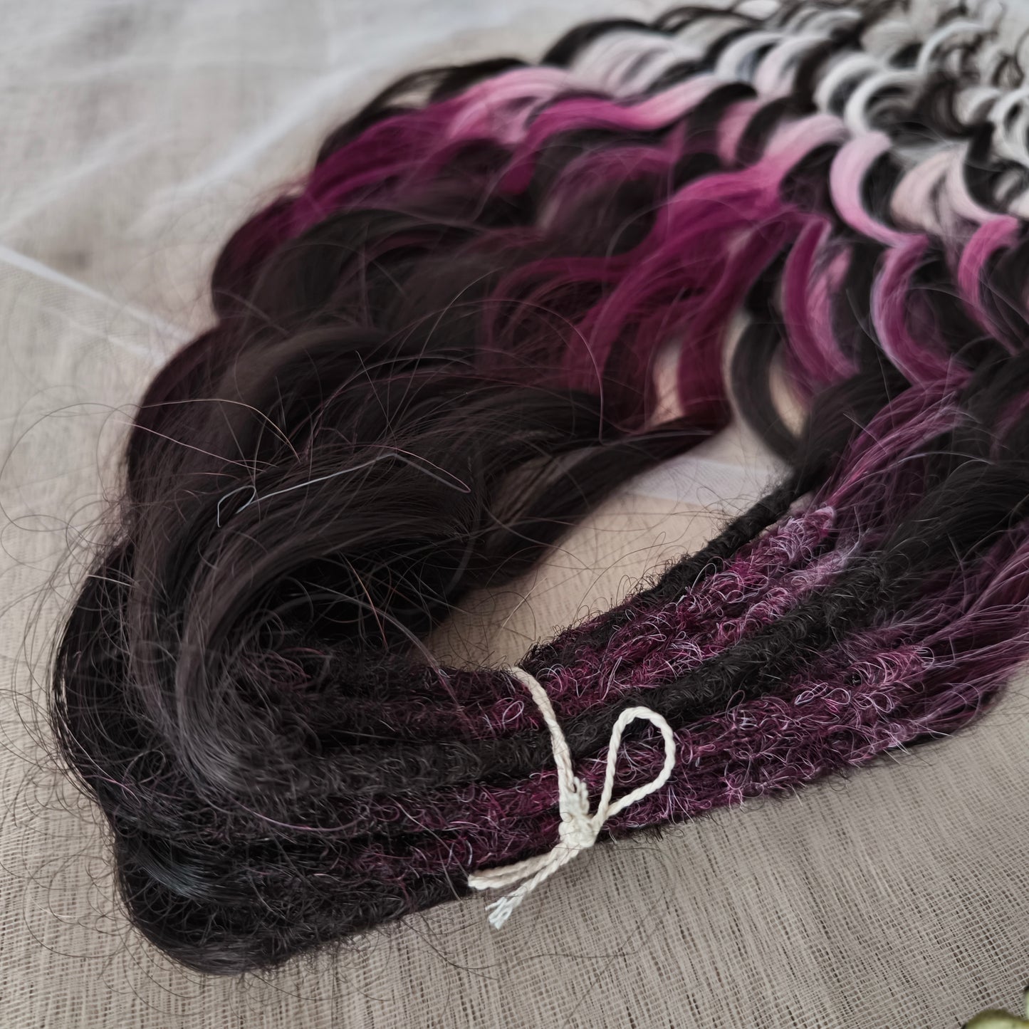 Velvet Twilight - handcrafted set features a rich gradient of deep chocolate brown, dark berry, magenta, and icy platinum - perfect for those who love a dramatic yet elegant look.
Soft, lightweight, and reusable synthetic brushable double ended wavy dreadlocks.