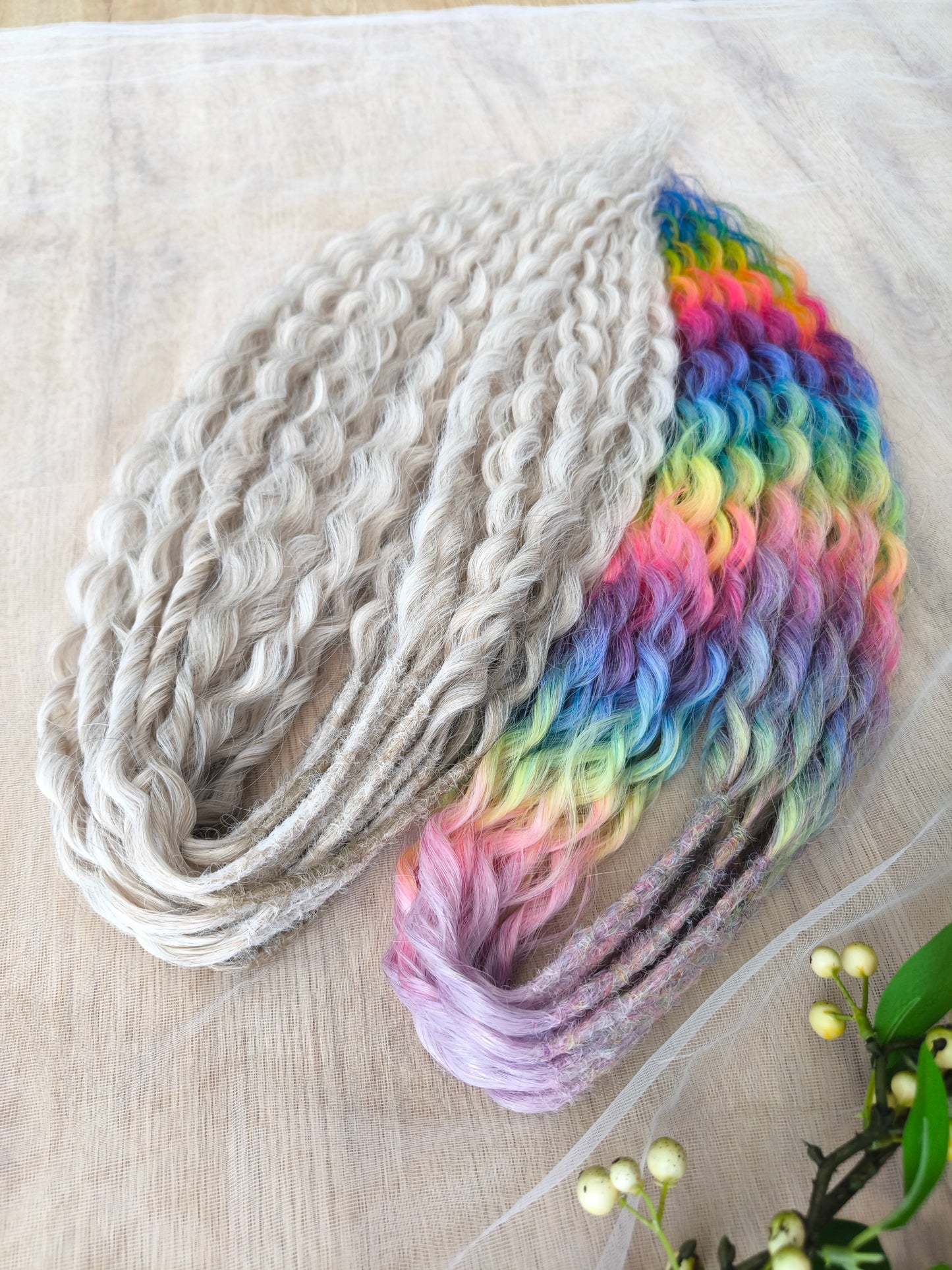 White Rainbow: the mix of Platinum Blonde (2/3 parts of blonde) + and Rainbow/glitch/prism effect (1/3 part of rainbow) soft, lightweight, and reusable synthetic brushable double ended wavy dreadlocks (NOT BRUSHABLE).