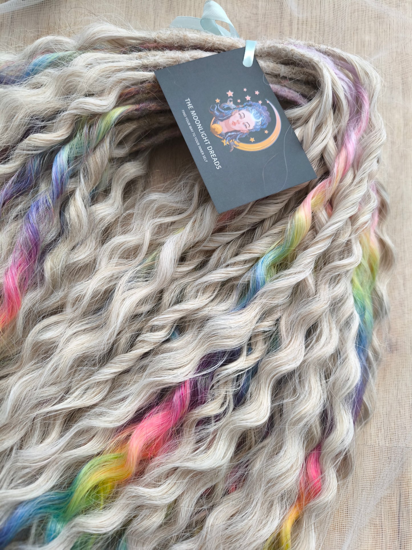 White Rainbow: the mix of Platinum Blonde (2/3 parts of blonde) + and Rainbow/glitch/prism effect (1/3 part of rainbow) soft, lightweight, and reusable synthetic brushable double ended wavy dreadlocks (NOT BRUSHABLE).