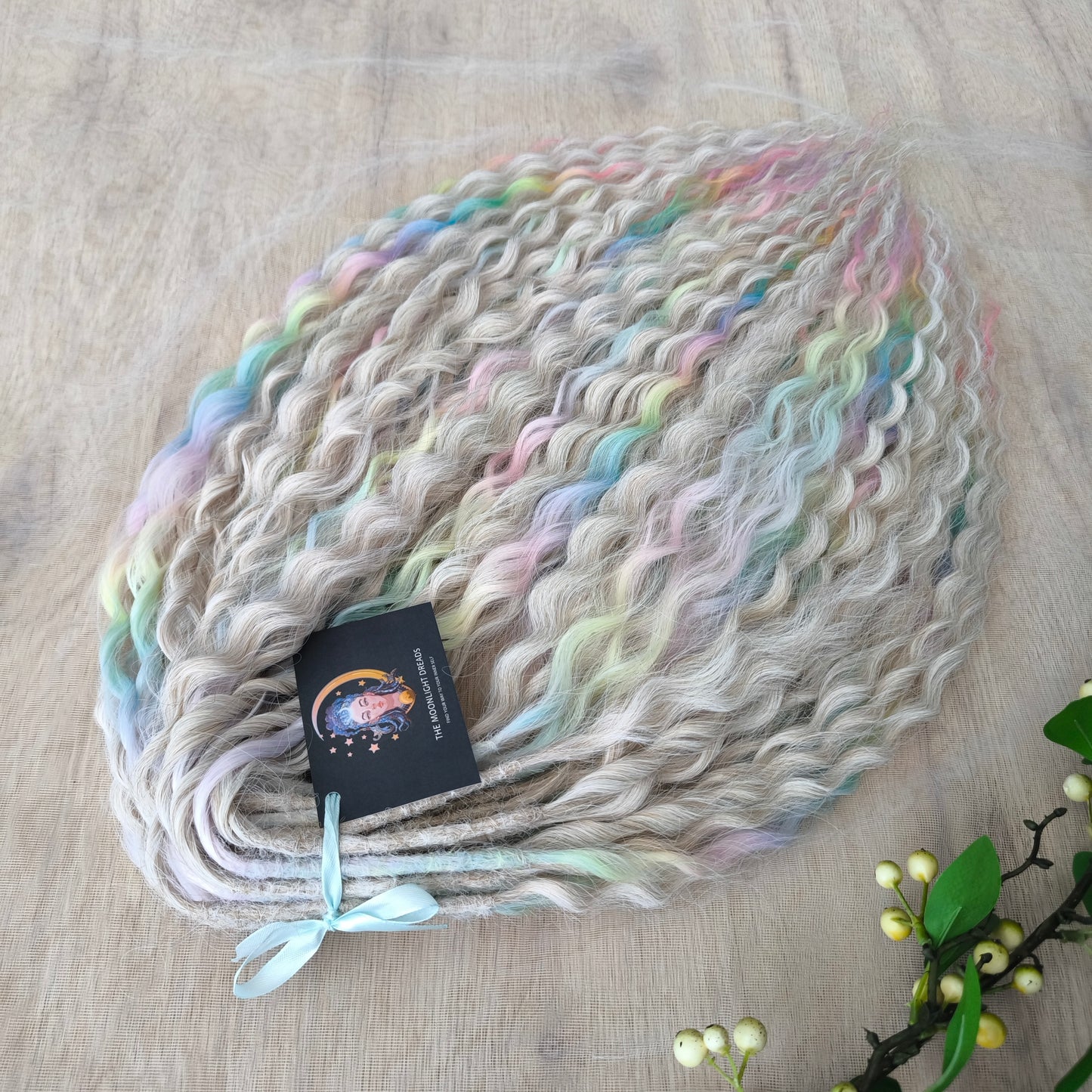 Pastel Unicorn: the mix of Platinum Blonde (2/3 parts of blonde) + and Pastel Rainbow/glitch/prism effect (1/3 part of rainbow) soft, lightweight, and reusable synthetic brushable double ended wavy dreadlocks (NOT BRUSHABLE)