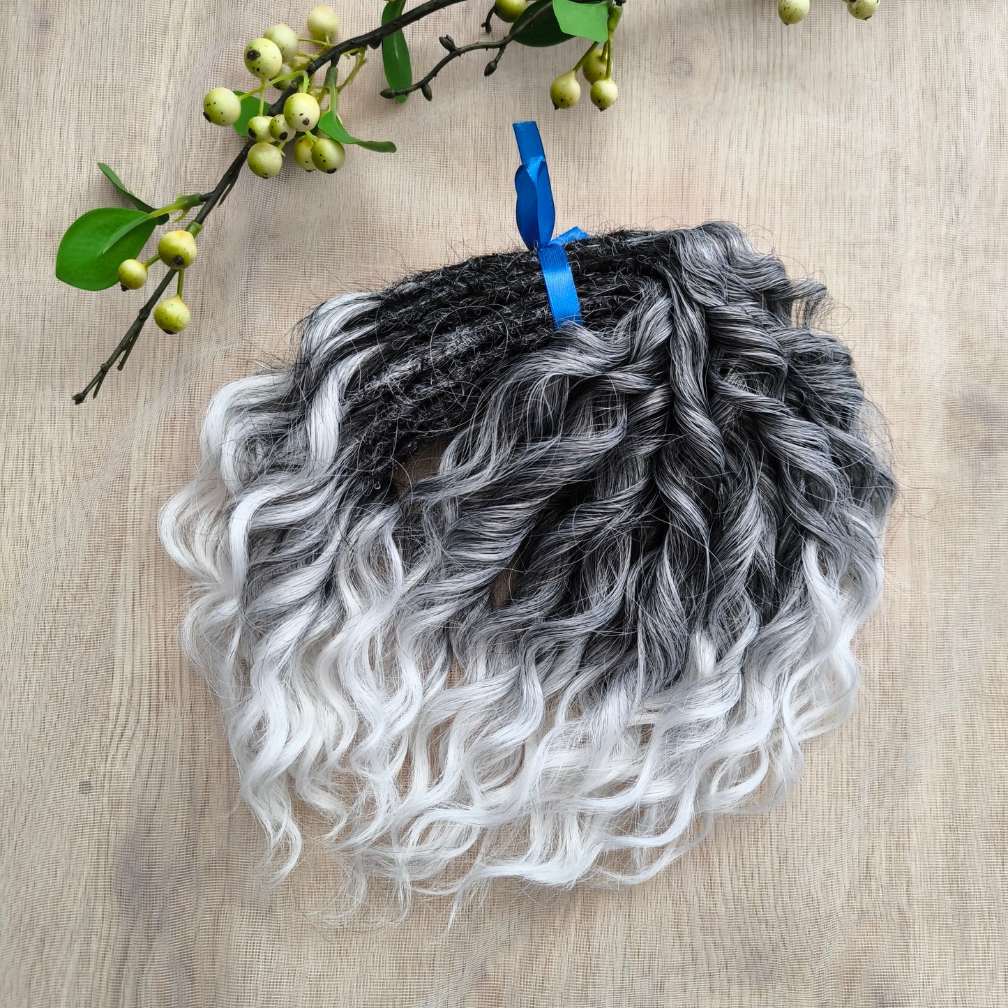 Salt and pepper: ombre from dark grey to white, natural-looking, short Jessica regular dreaded curls. The length is 10 inches (25 cm), dreaded part ±3-4 inches.