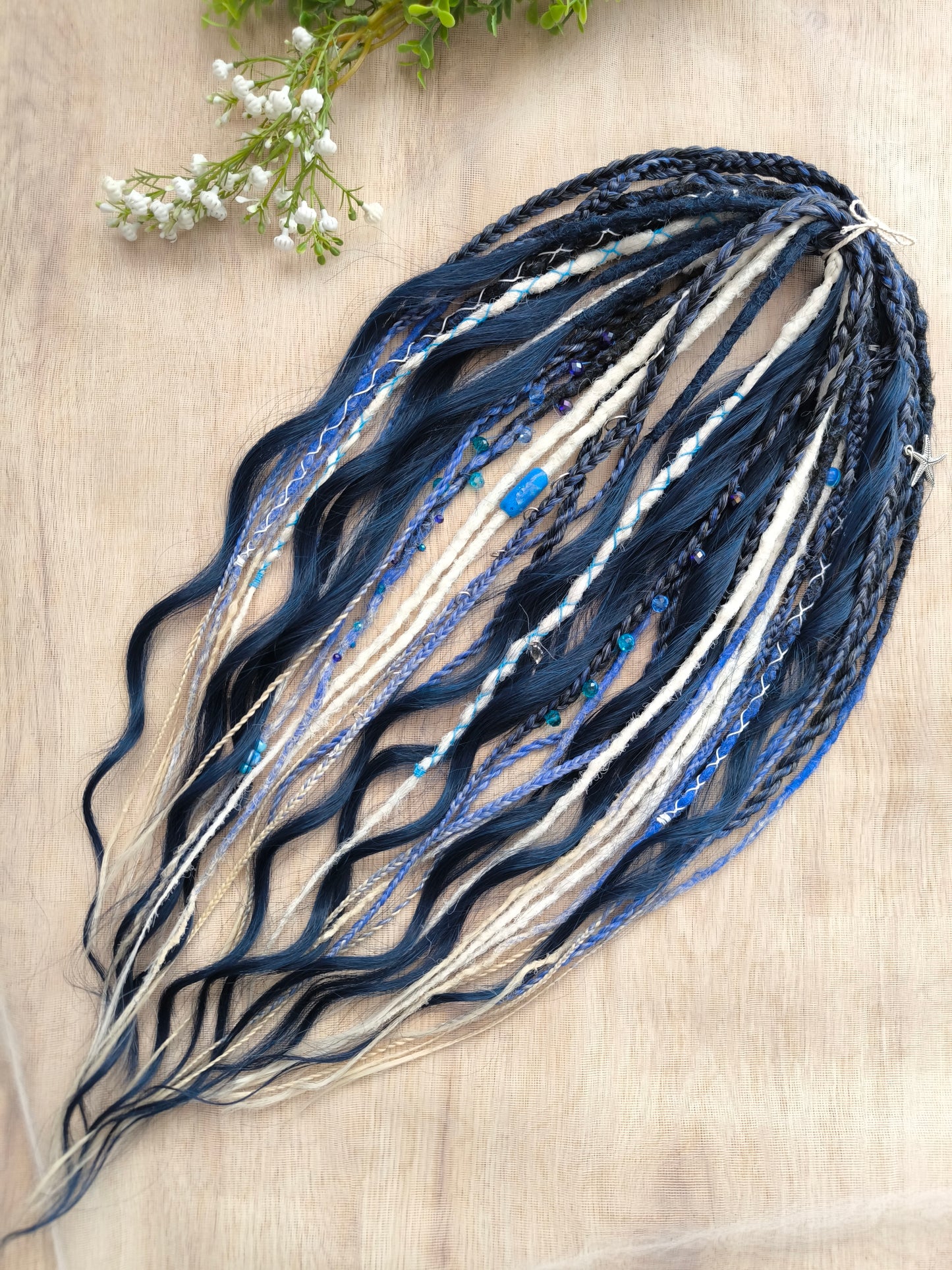 Deep blue see — navy blue, obmbre blue to blonde, and white partial set of 28 double ended synthetic dreadlocks, various braids, Senegalese twist, and brushable dreaded curls (decoration is included). Reusable lightweight set made from high-quality synthetic hypoallergenic material kanekalon.
Length: ±20-24 inches (50-60 cm)
Thickness of dreads and braids: ±0.6-0.8 cm
Dreaded part of curls ±3-4 inches (8-10 cm)
Weight with decoration: ±175 gr (6 oz)
