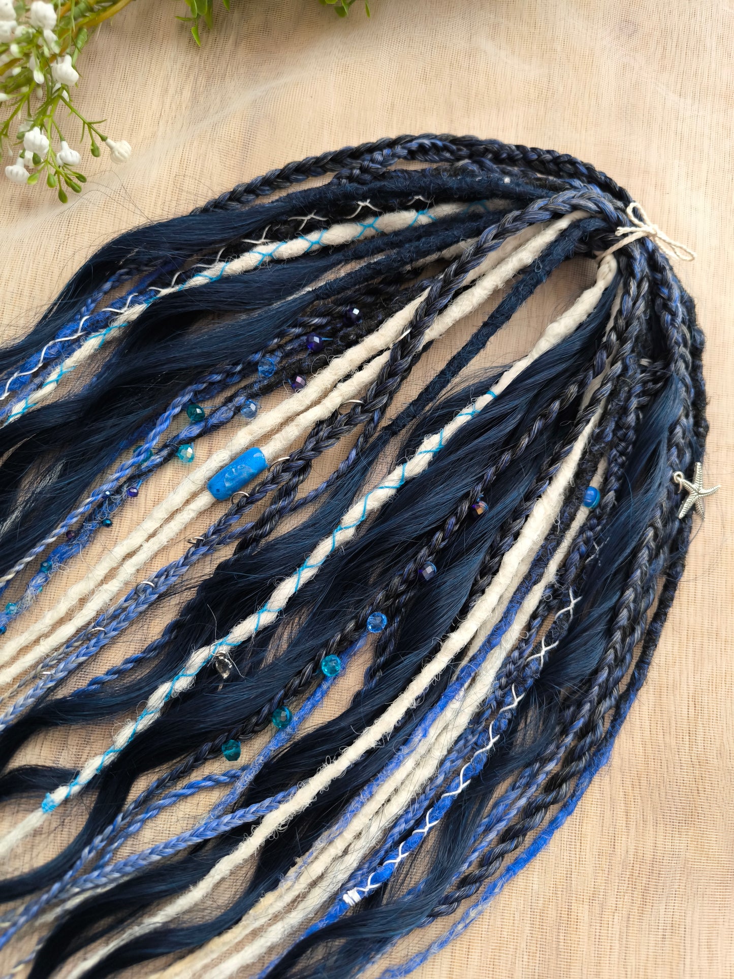Deep blue see — navy blue, obmbre blue to blonde, and white partial set of 28 double ended synthetic dreadlocks, various braids, Senegalese twist, and brushable dreaded curls (decoration is included). Reusable lightweight set made from high-quality synthetic hypoallergenic material kanekalon.
Length: ±20-24 inches (50-60 cm)
Thickness of dreads and braids: ±0.6-0.8 cm
Dreaded part of curls ±3-4 inches (8-10 cm)
Weight with decoration: ±175 gr (6 oz)