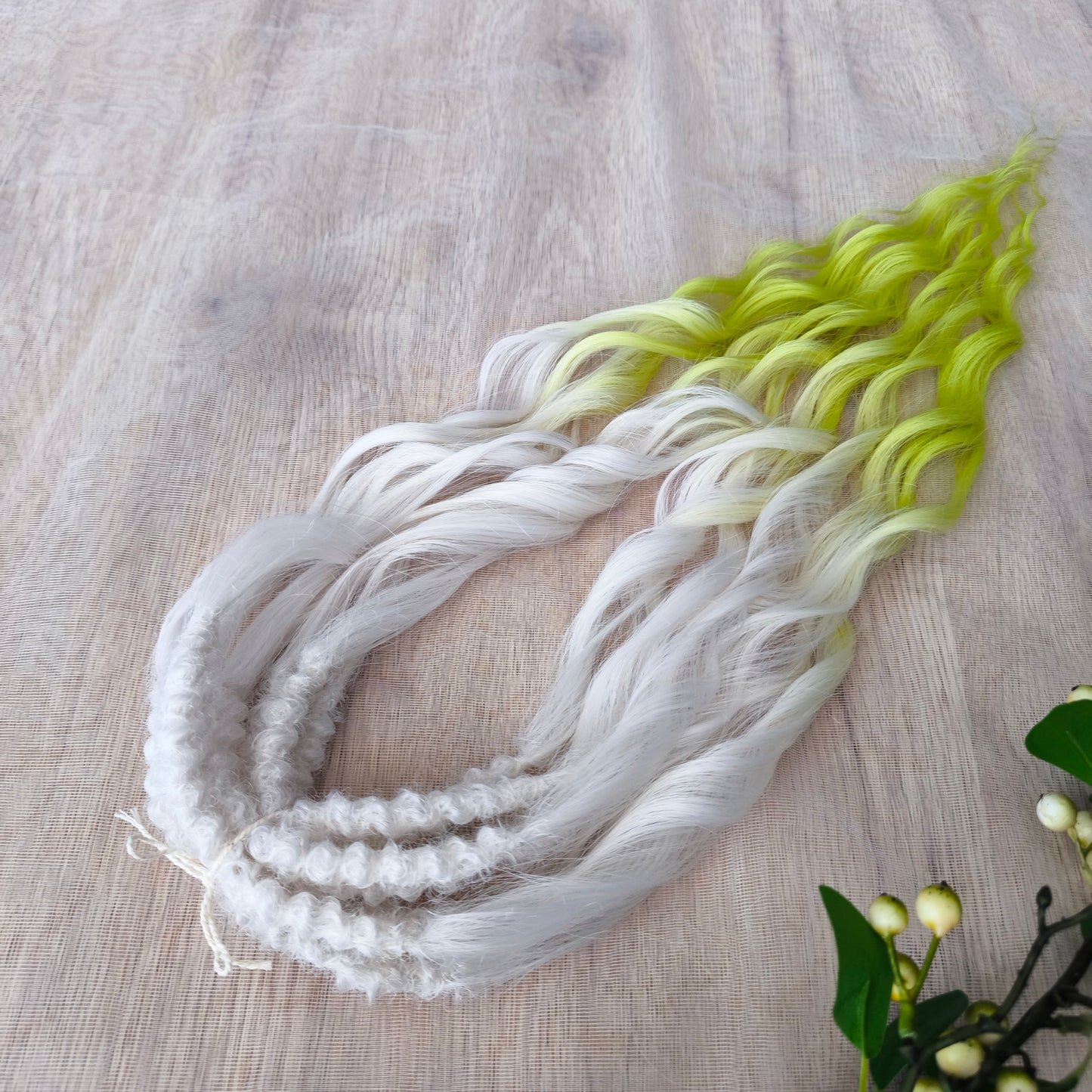 Lemon Frost - radiant ombré starts with an icy white base, melts into soft pastel lemon, and flows into a bold neon yellow-green at the tips. Soft, lightweight, and reusable synthetic brushable double ended wavy dreadlocks (regular dreaded, braided middle, or push-up).