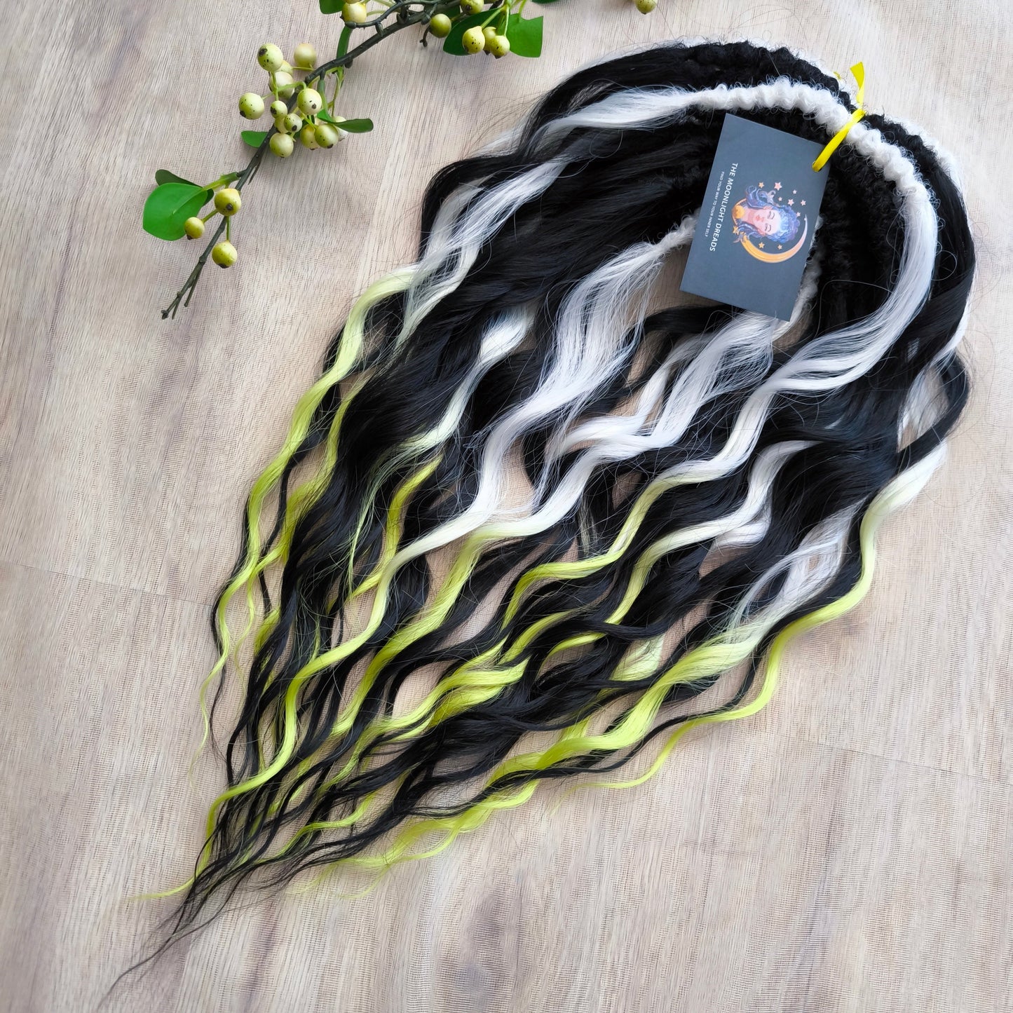 Black and radiant ombré starts with an icy white base, melts into soft pastel lemon, and flows into a bold neon yellow-green at the tips. Soft, lightweight, and reusable synthetic brushable double ended wavy dreadlocks (regular dreaded, braided middle, or push-up).