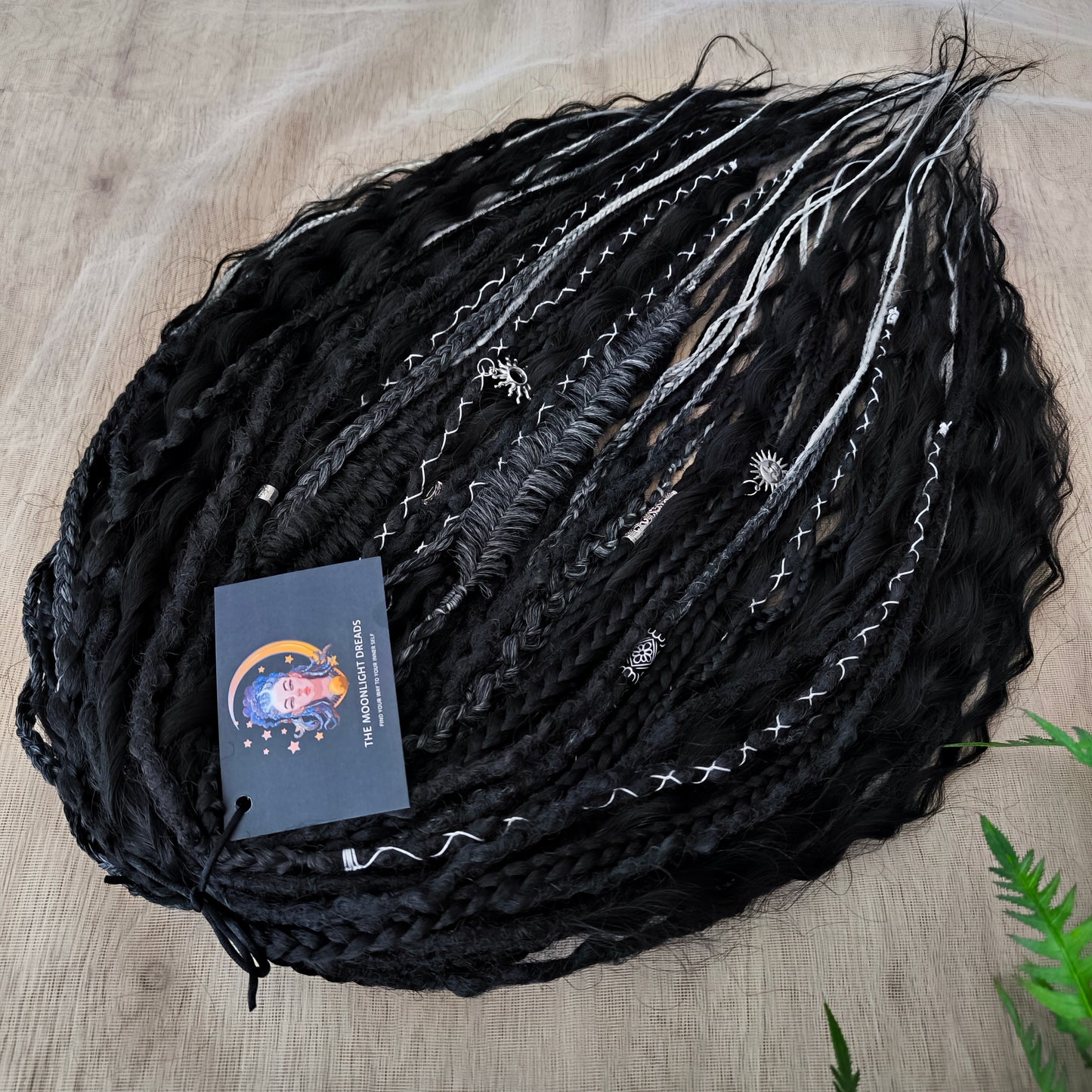 Pagan Witch — black, gray, and white/blonde set of 55 double ended synthetic bumpy dreads, braids, Senegalese twist, and dreaded curls (decoration is included). Reusable lightweight set made from high-quality synthetic hypoallergenic material kanekalon.
Standard length: ±22-24 inches (55-60 cm)
Thickness of dreads and braids: ±0.6-0.8 cm
Dreaded part of curls ±3-4 inches (8-10 cm)
Weight with decoration: ±310 gr (11 oz)