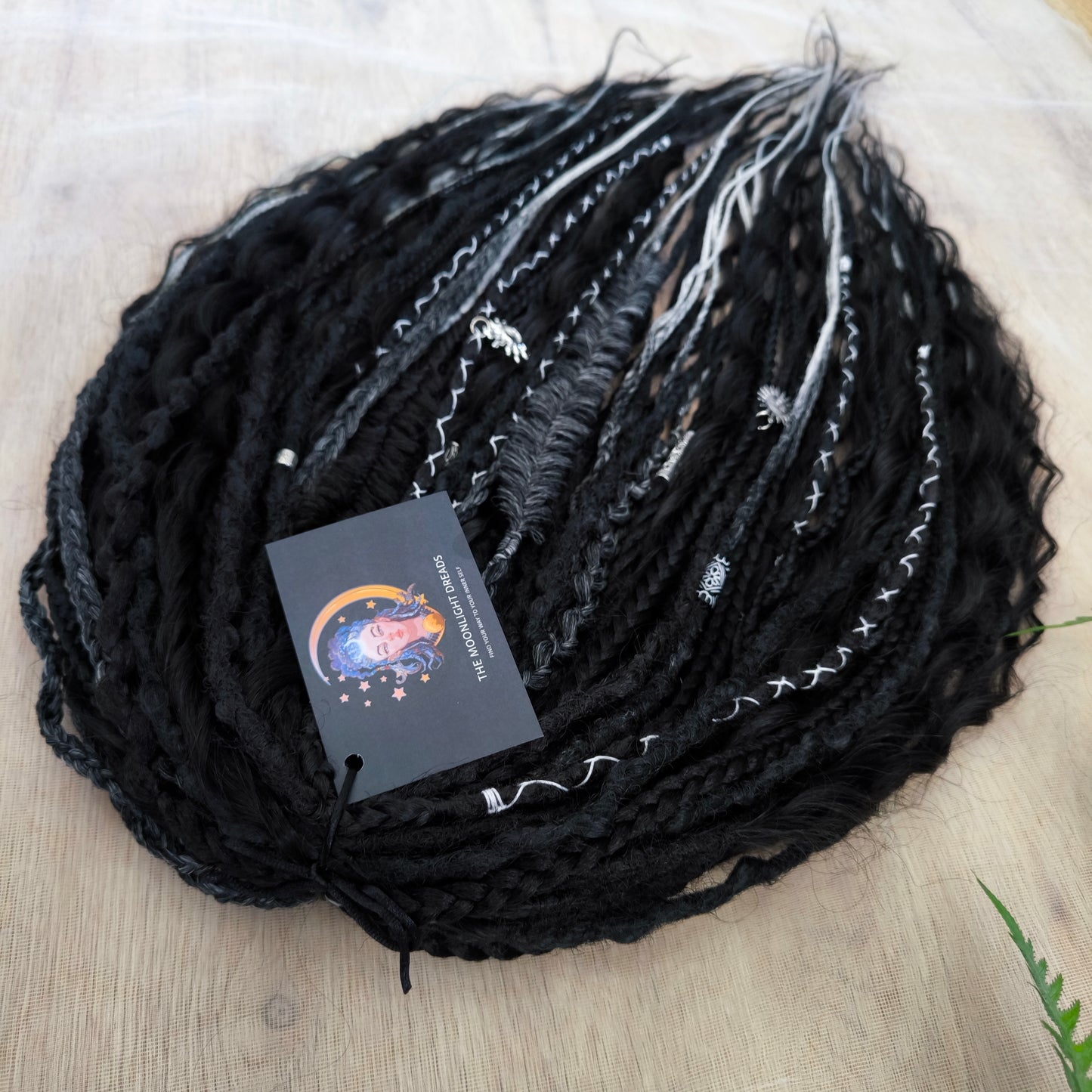 Pagan Witch — black, gray, and white/blonde set of 55 double ended synthetic bumpy dreads, braids, Senegalese twist, and dreaded curls (decoration is included). Reusable lightweight set made from high-quality synthetic hypoallergenic material kanekalon.
Standard length: ±22-24 inches (55-60 cm)
Thickness of dreads and braids: ±0.6-0.8 cm
Dreaded part of curls ±3-4 inches (8-10 cm)
Weight with decoration: ±310 gr (11 oz)