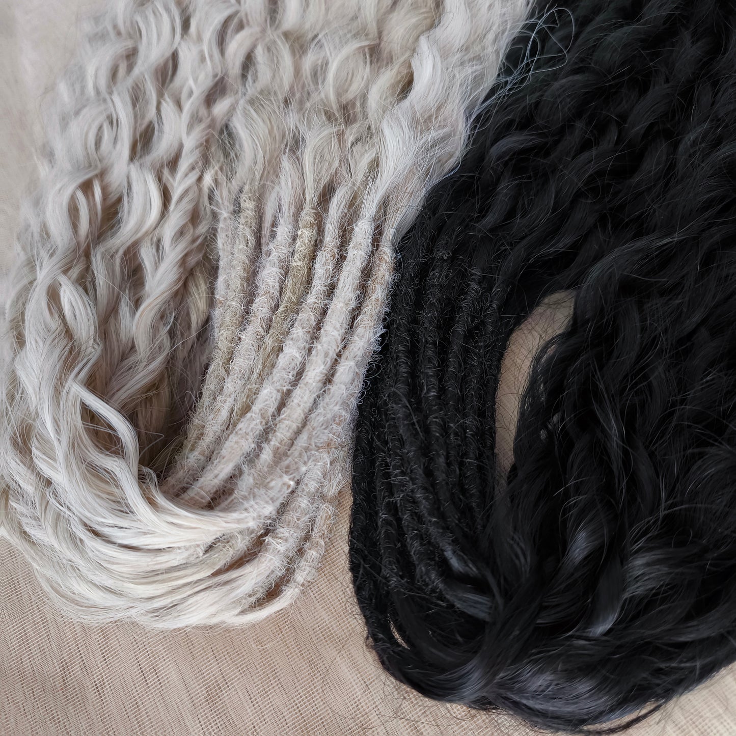 Black and white/blonde set of 62 double ended synthetic non-brushable dreaded curls.
Length: ±28-30 inches (70-75 cm)
Dreaded part of curls ±3-4 inches (8-10 cm)
Weight: ±420 gr (15 oz)