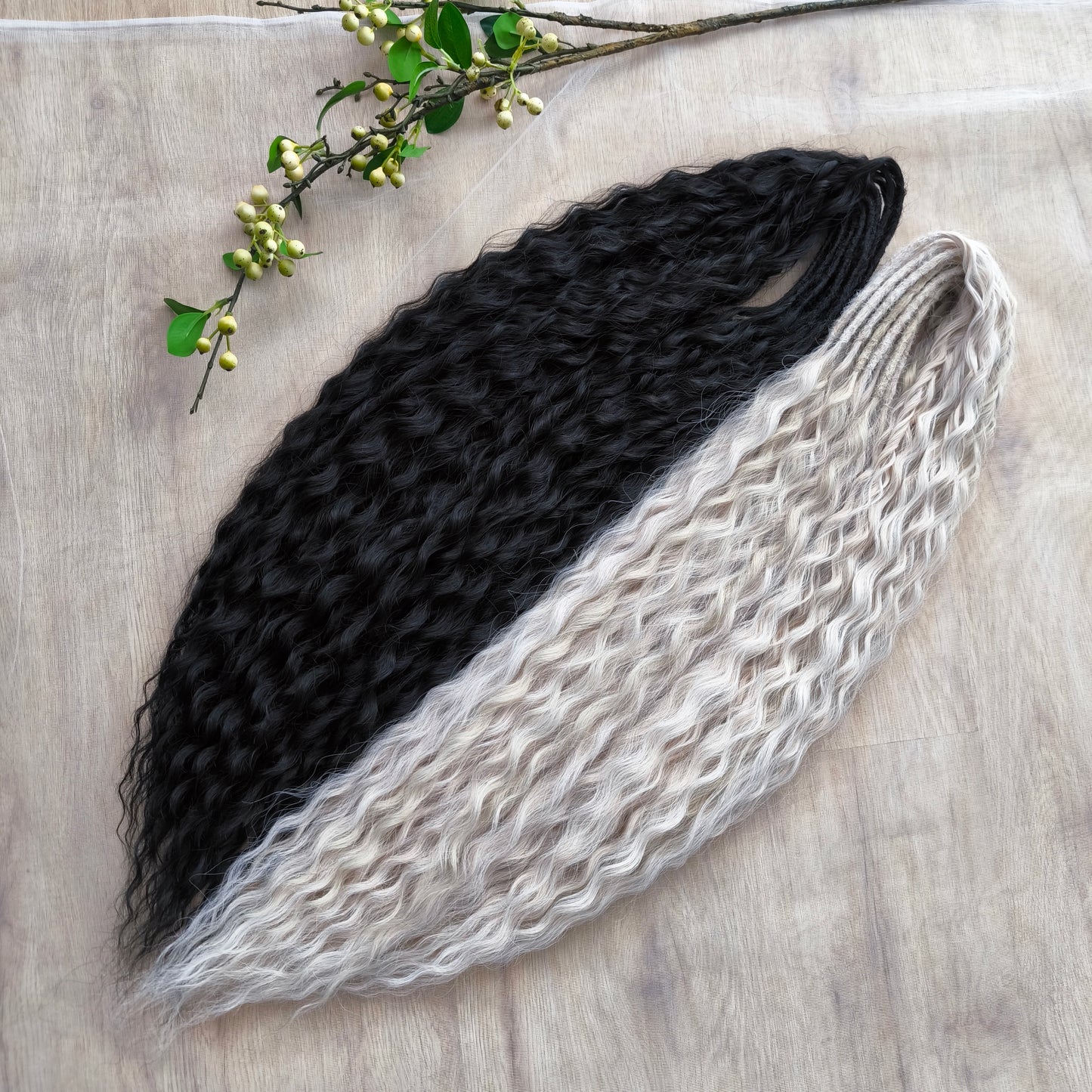 Black and white/blonde set of 62 double ended synthetic non-brushable dreaded curls.
Length: ±28-30 inches (70-75 cm)
Dreaded part of curls ±3-4 inches (8-10 cm)
Weight: ±420 gr (15 oz)
