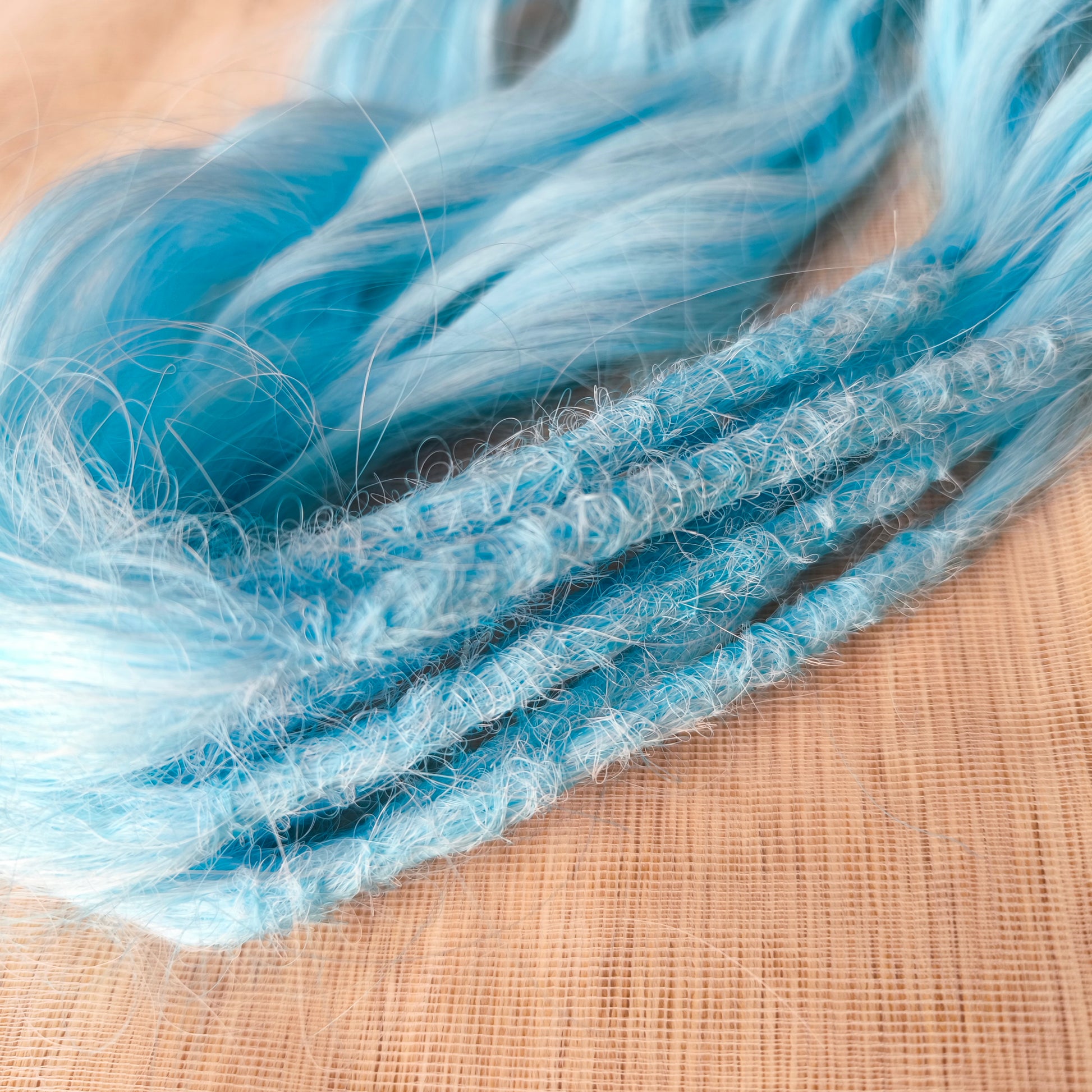 Sky blue soft, lightweight, and reusable synthetic brushable double ended wavy dreadlocks (regular dreaded, braided middle, or push-up).