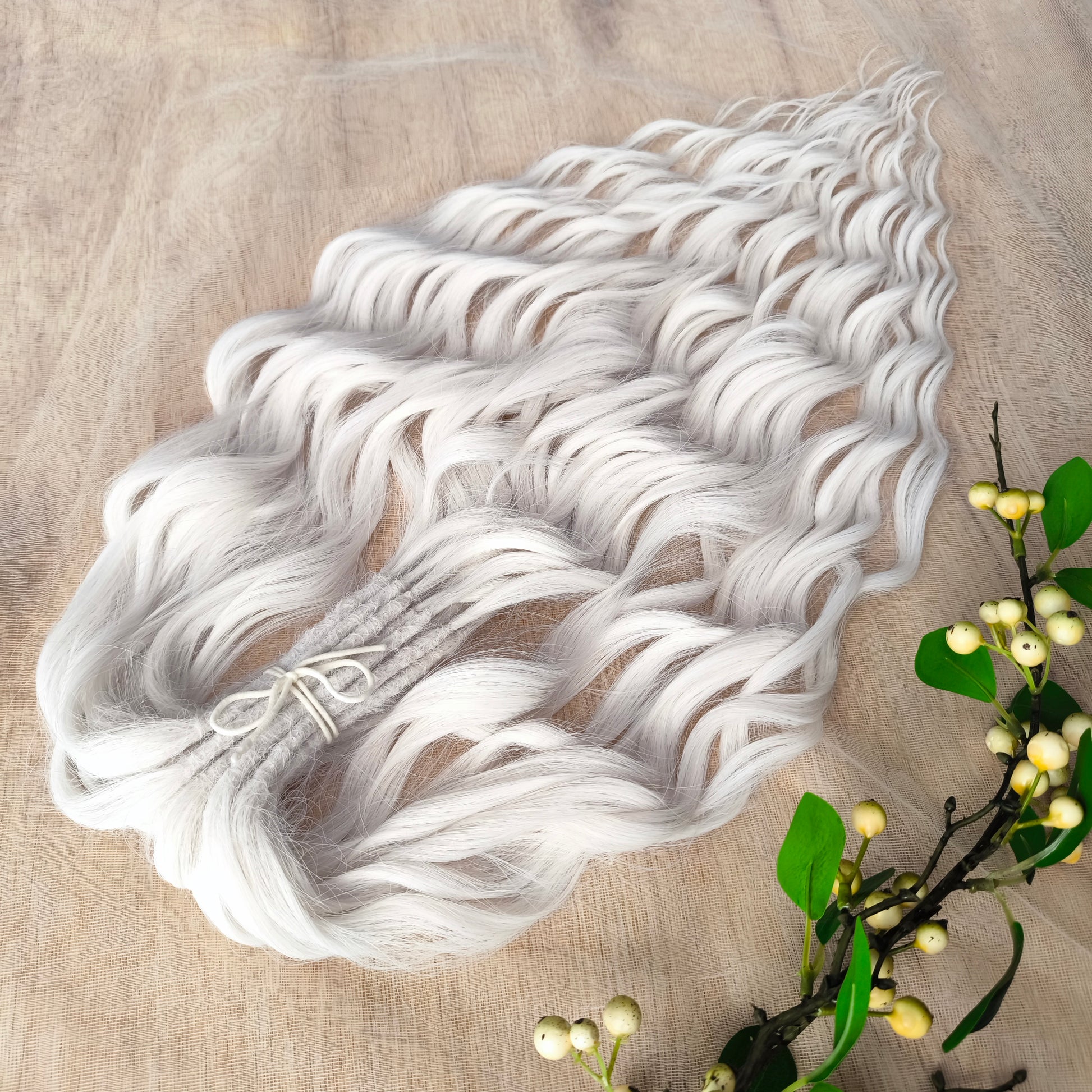 Snow-white soft, lightweight, and reusable synthetic brushable double ended wavy dreadlocks (regular dreaded, braided middle, or push-up).